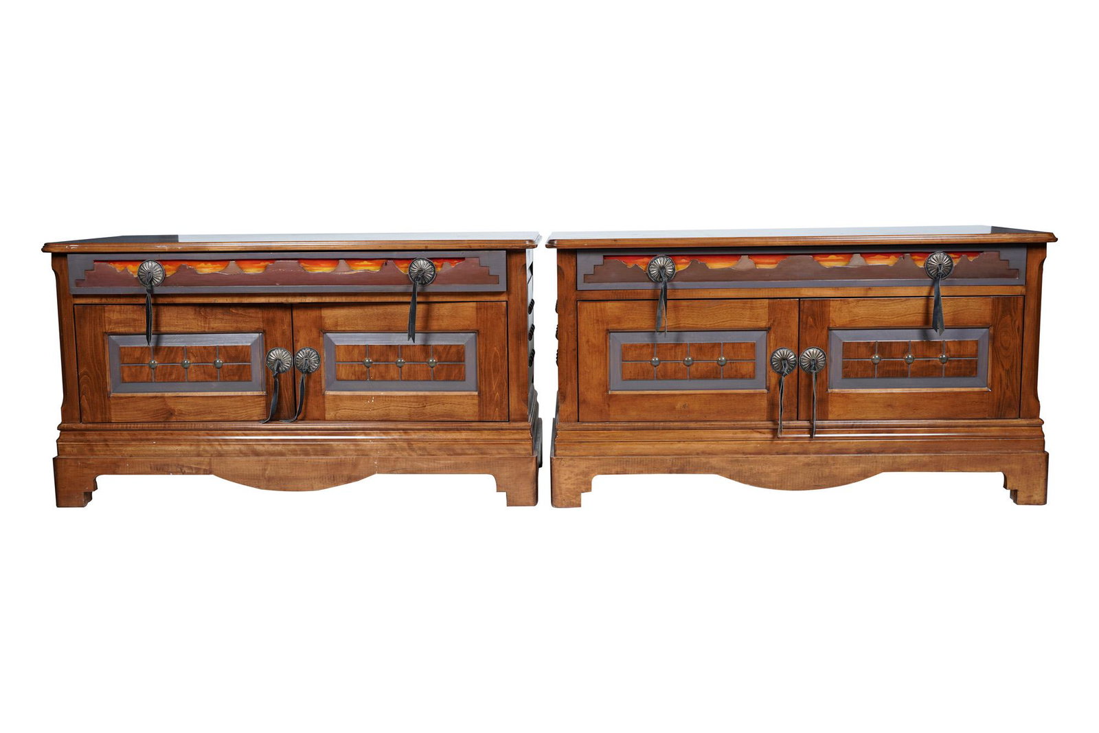 PAIR OF WESTERN-STYLE END TABLES: with cut-out landscape silhouette over painted sunset scene to each frieze drawer, and metal and leather pulls Condition: good with general marks, scratches, and wear commensurate with use. 48 inches 