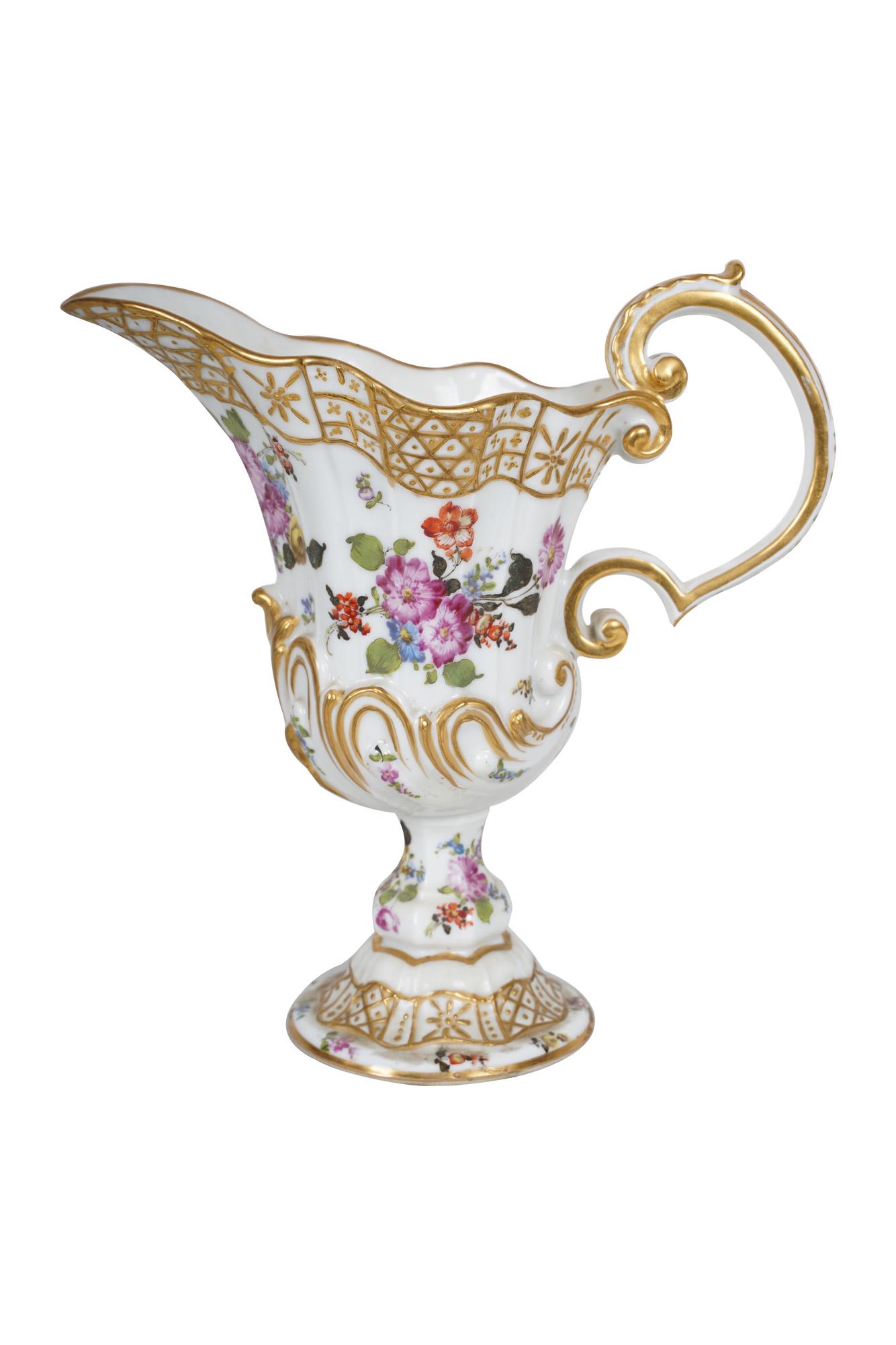 MEISSEN PORCELAIN EWER: underglaze blue crossed swords mark Condition: no chips. Earthoquake cement to underside 8 1/2 inches high