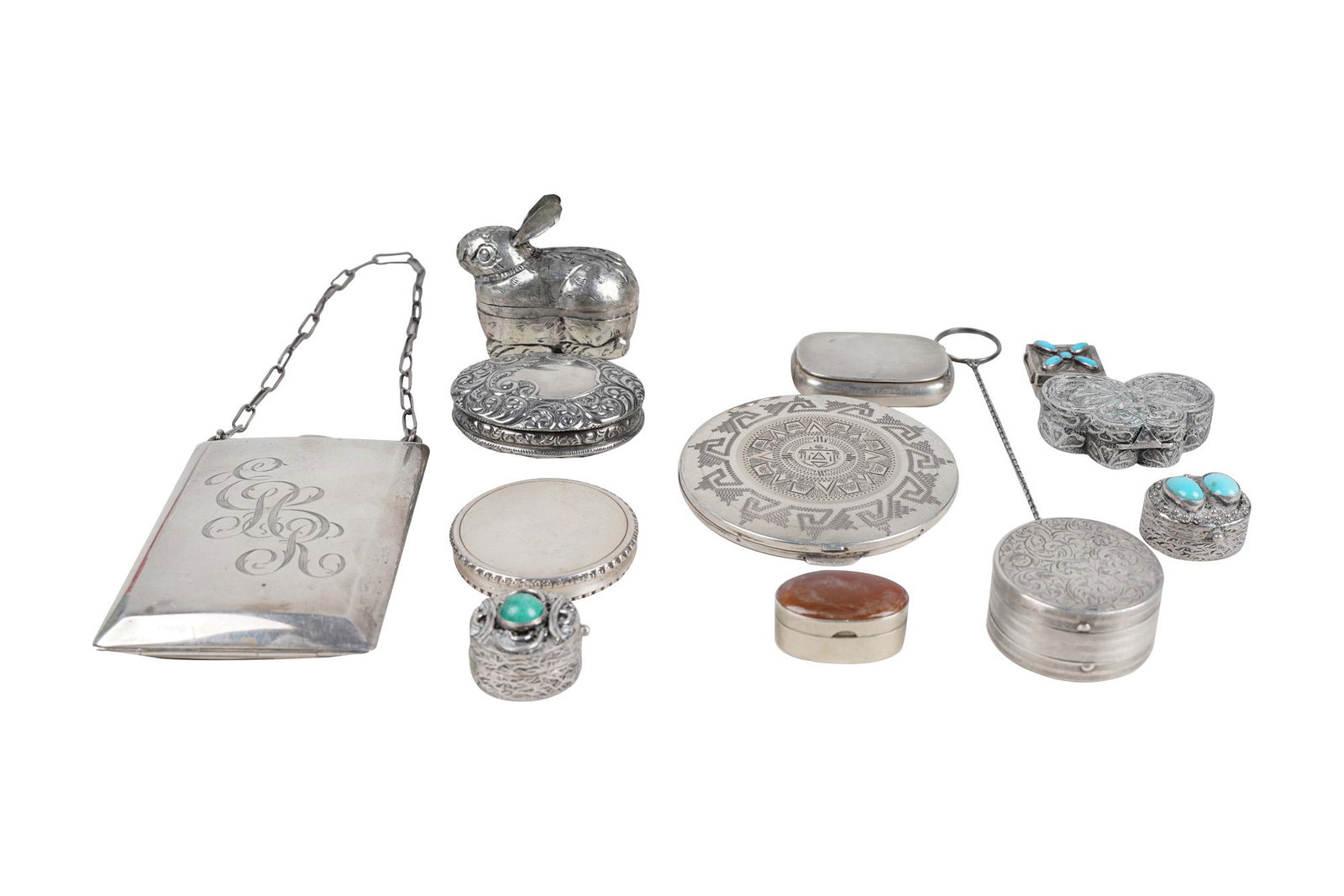 TWELVE SILVER OBJETS: some marked 'Sterling' comprising a minaudiere (monogrammed), two powder compacts on chain, five semi-precious stone-inlaid pill boxes, three pill boxes, and two animal-form boxes