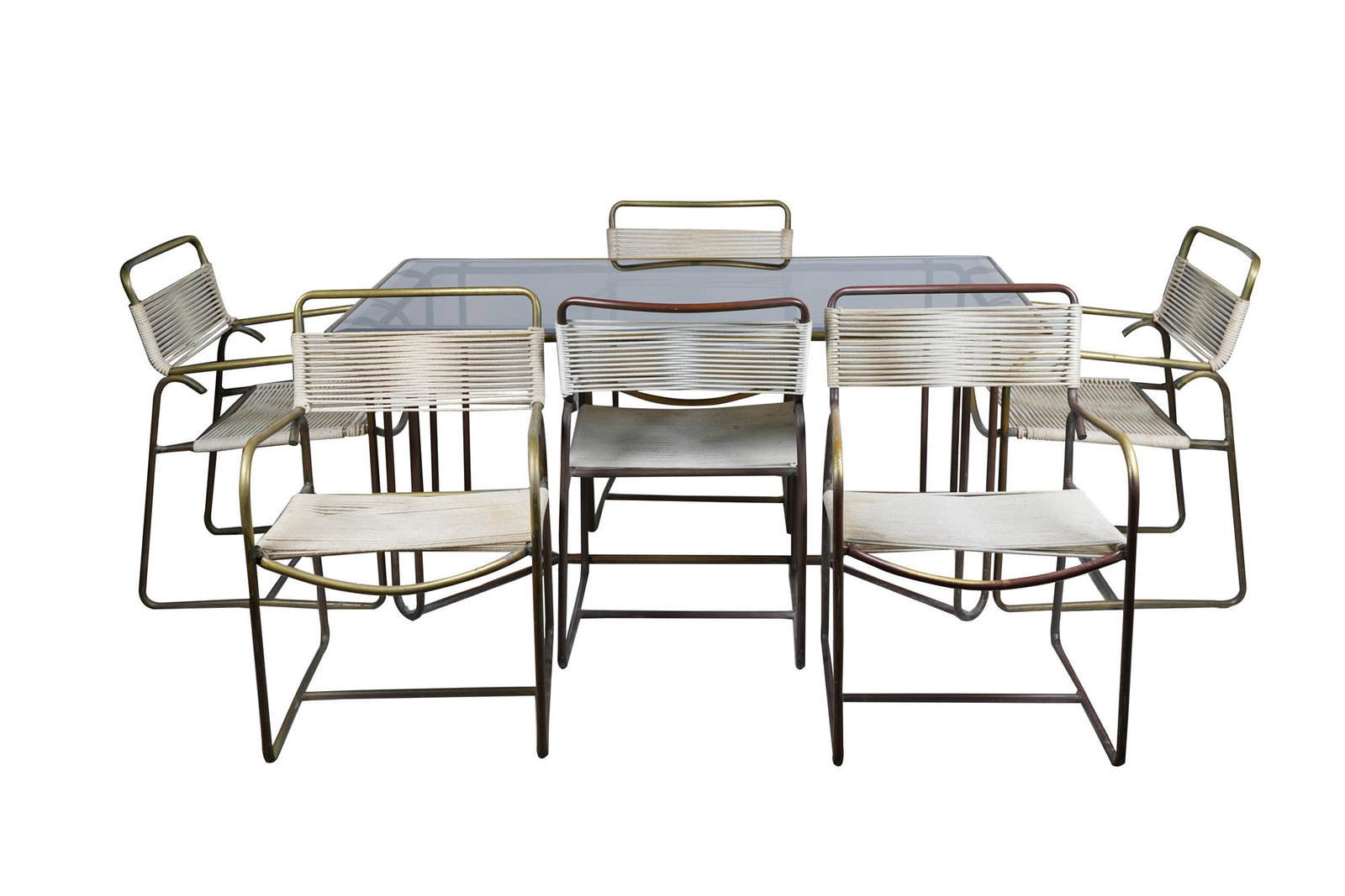 WALTER LAMB PATIO SET: comprising a table and six chairs Condition: patination having having been cleaned; one chair in need of rewelding at arm connection the table top: 62 3/4 x 35 1/2 inches