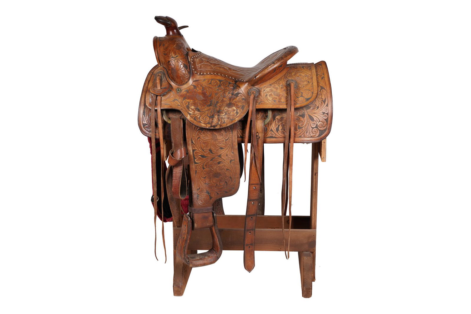 PORTER CO. TOOLED LEATHER SADDLE: 27 inches wide; 20 inches deep