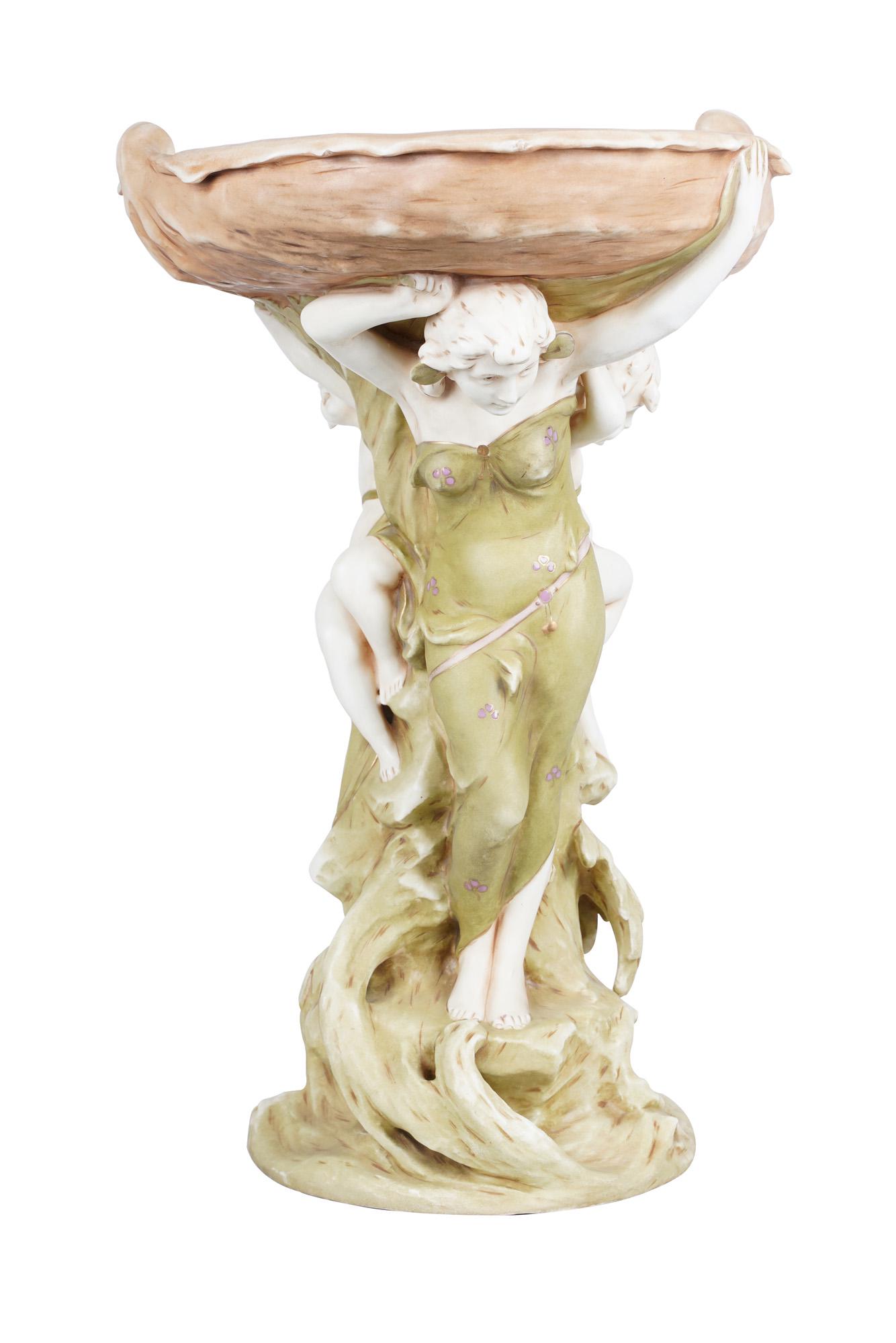 ROYAL DUX ART NOUVEAU FIGURAL PORCELAIN JARDINIERE: impressed to underside "10388" and "42" Condition: good, no chips or cracks. No apparent restorations. 16 inches wide; 12 1/2 inches deep; 21 inches high