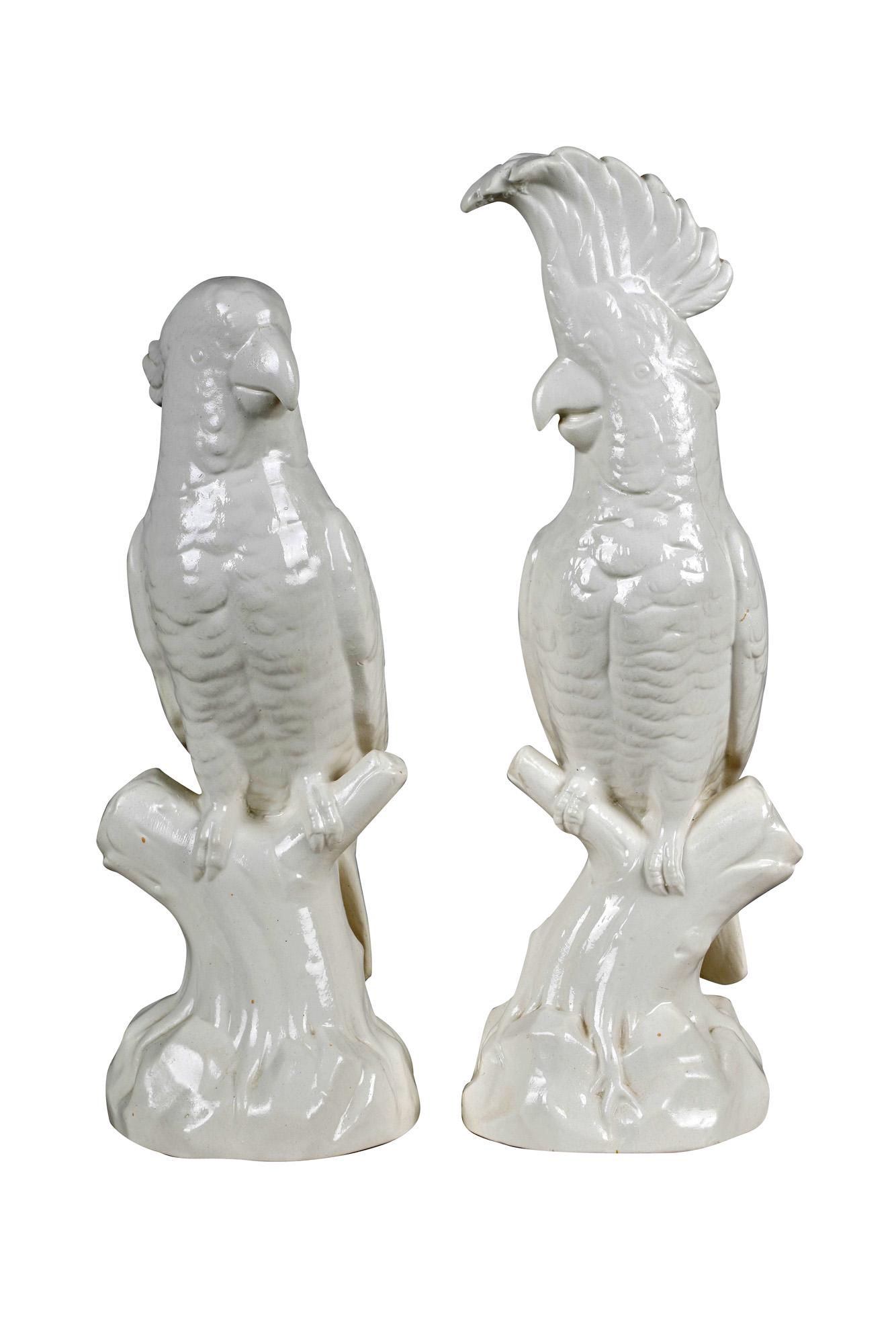 PAIR OF MINTONS PORCELAIN PARROTS: each marked to underside: "18th Cent., Stafforshire salt-glaze" Condition: one with two glaze cracks to side of head 14 inches high