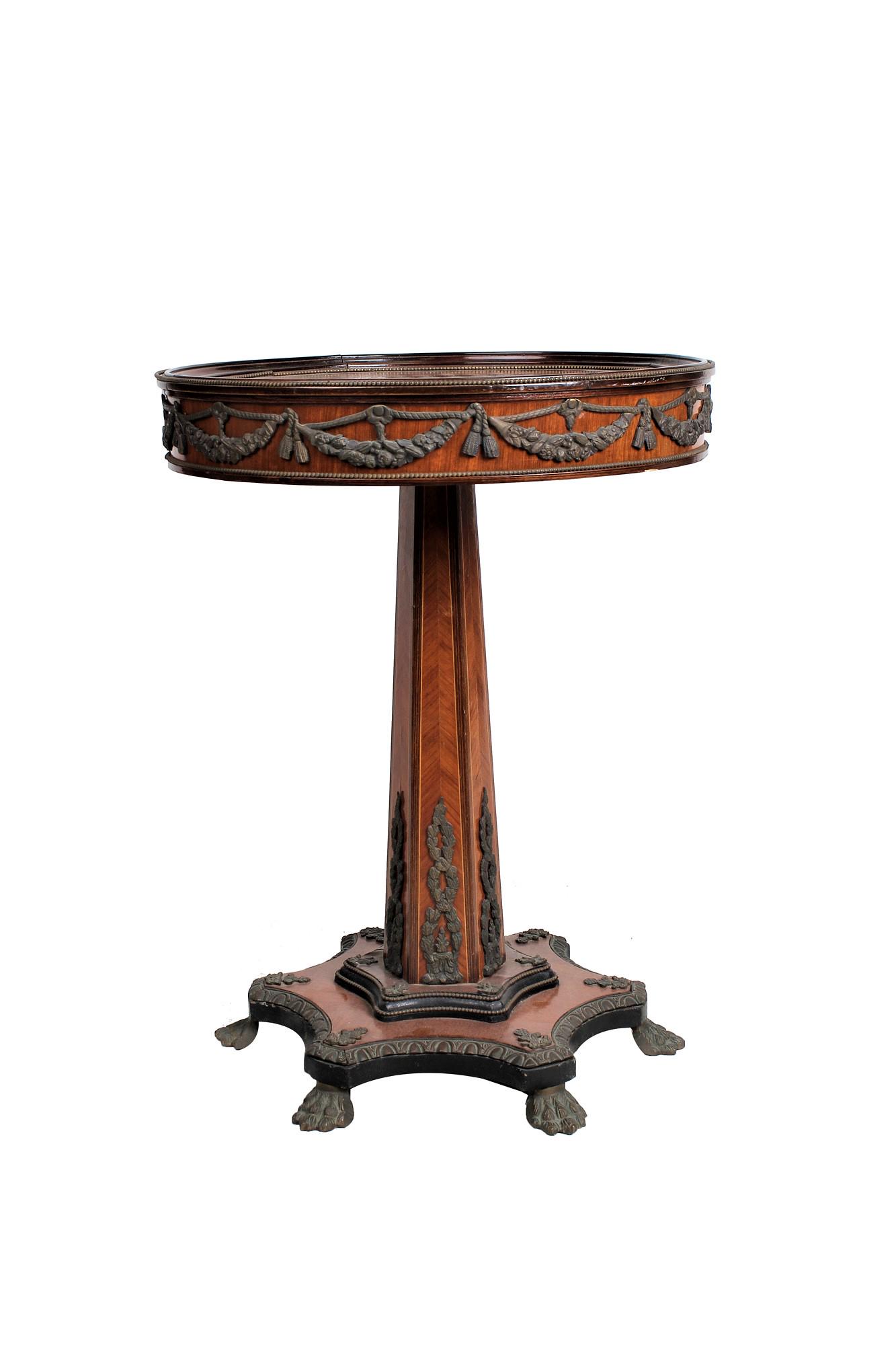 CHARLES X STYLE METAL-MOUNTED MAHOGANY GUERIDON: Condition: a small loss to carved wood molding of top 21 3/4 inches diameter; 28 1/2 inches high
