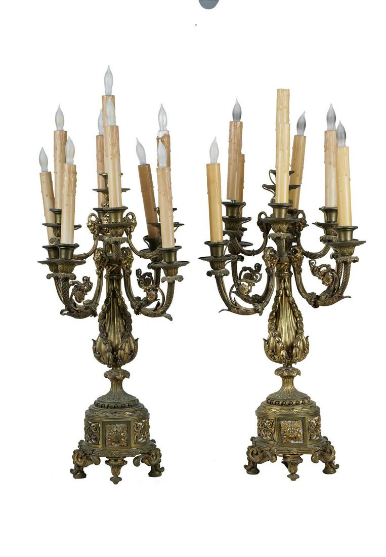 PAIR OF NINE-LIGHT BRONZE CANDELABRA: electrified as table lamps 24 inches high