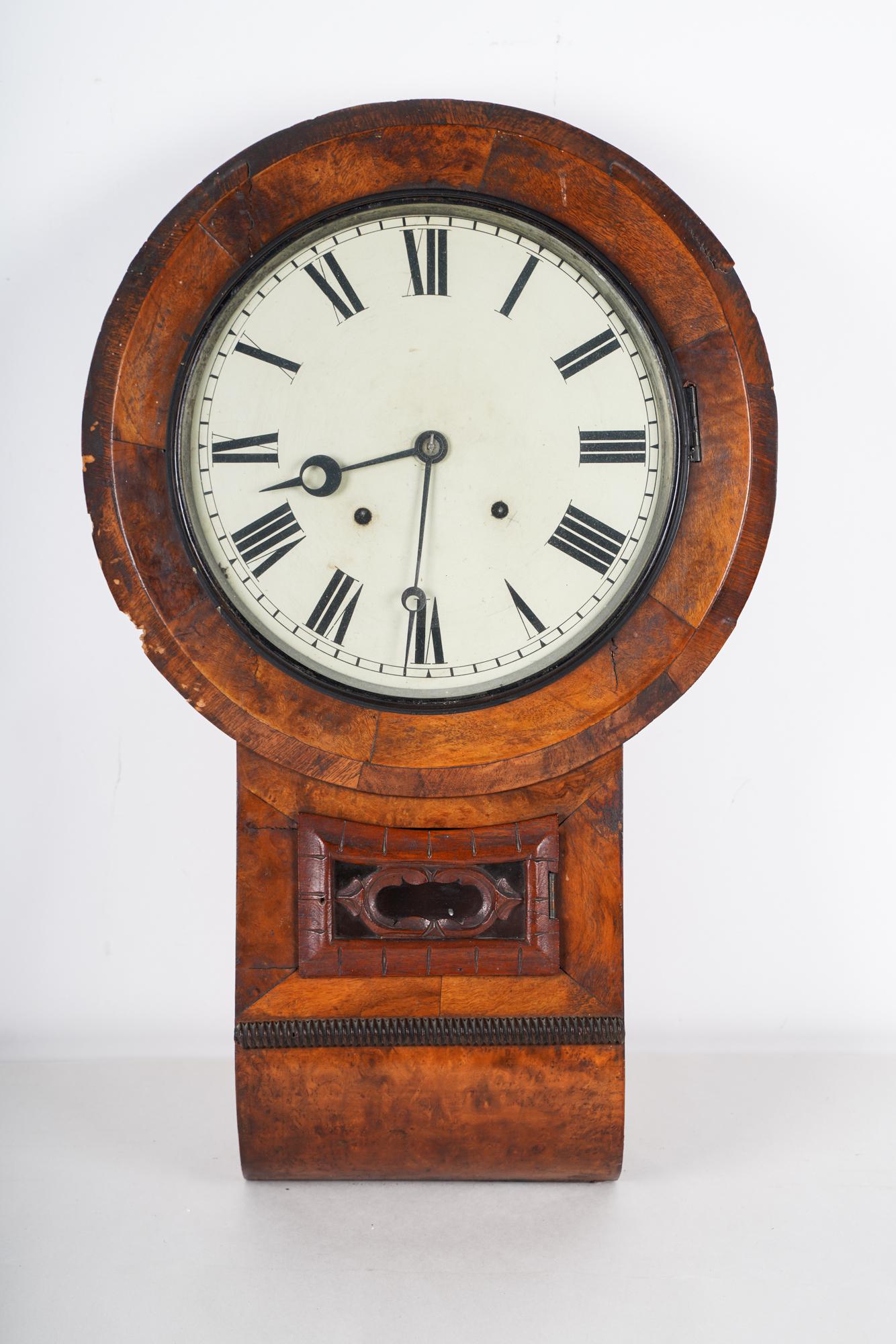 WALNUT WALL CLOCK: Condition: areas of loss to wood at edges 17 inches wide; 27 inches high