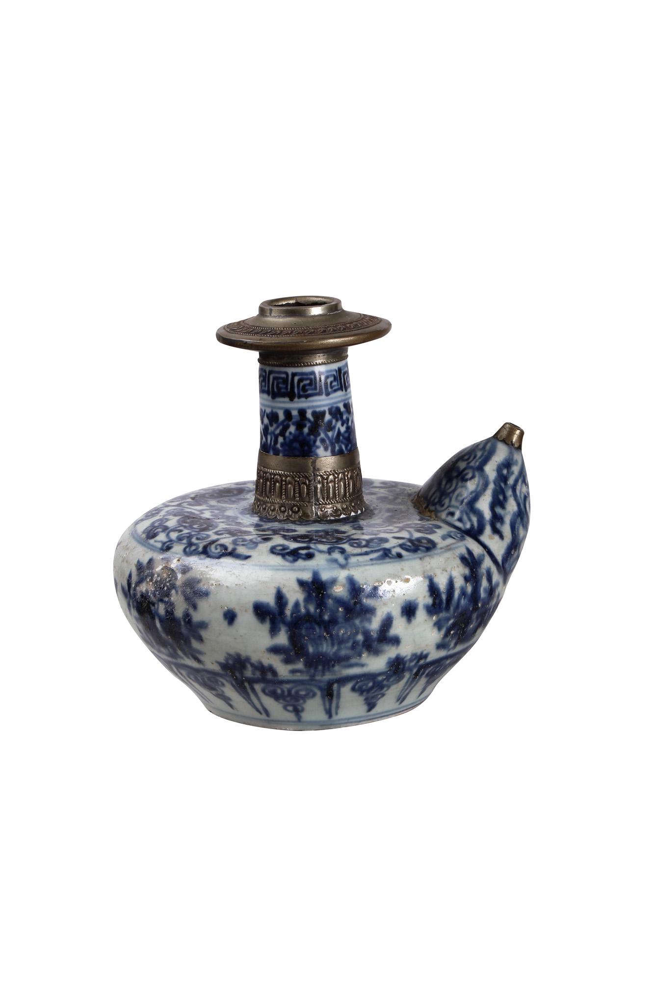 CHINESE PORCELAIN KENDI: possibly Ming Dynasty bulbous body decorated with overall underglaze blue scrolling vines and the narrow neck set with a later silver ring and opened disk Condition: with restoration to spout, surface