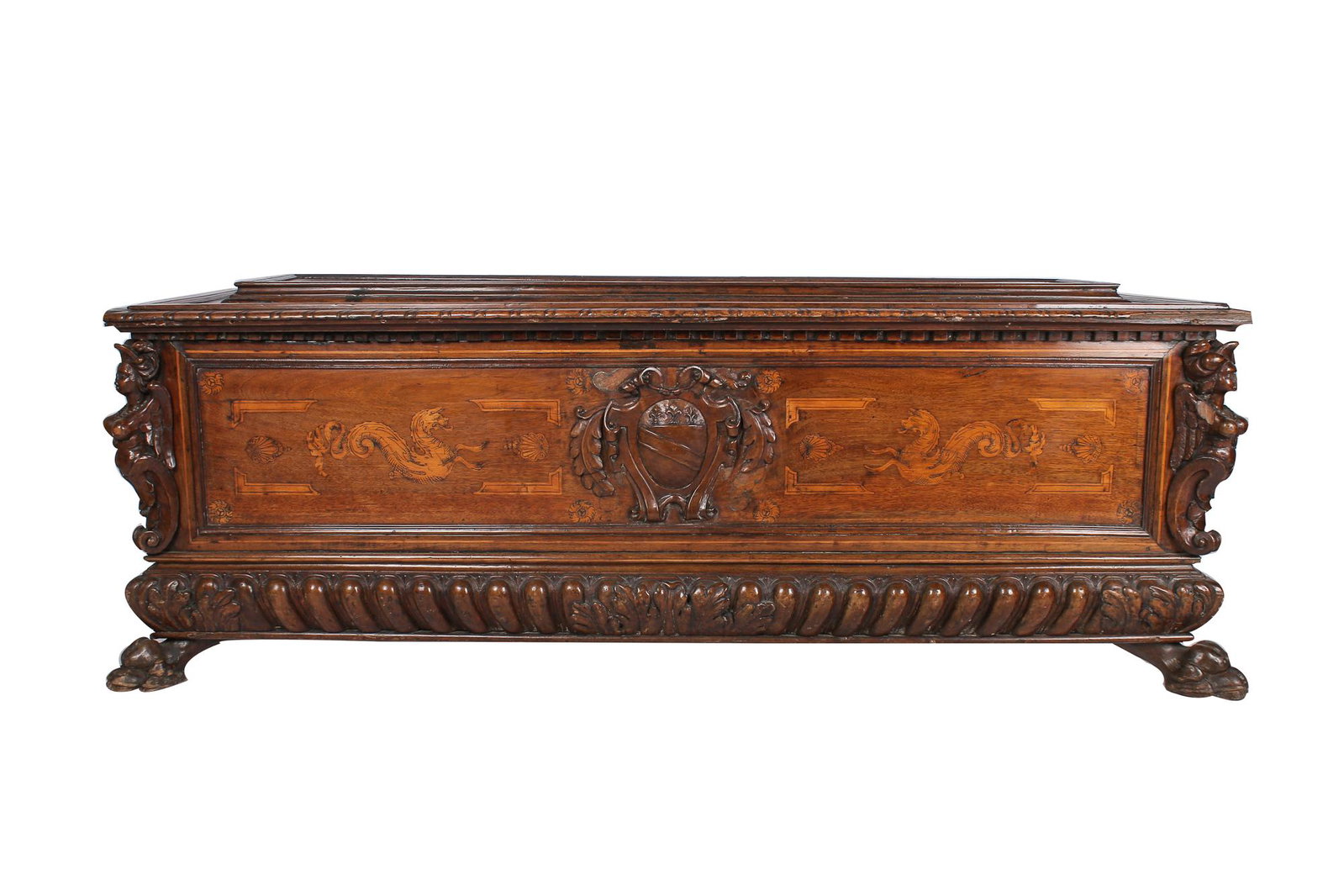 ITALIAN CARVED WALNUT & MARQUETRY INLAID CASSONE: Condition: separation of wood on lid, minor chips and scuffs commensurate with age, missing piece of molding to front left corner 70 inches wide; 23 inches deep; 26 inches high