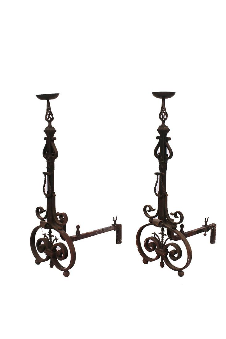 PAIR OF WROUGHT IRON ANDIRONS: Condition: each with oxidation throughout, and scattered white marks. each 23 1/2 inches deep; 37 1/2 inches high