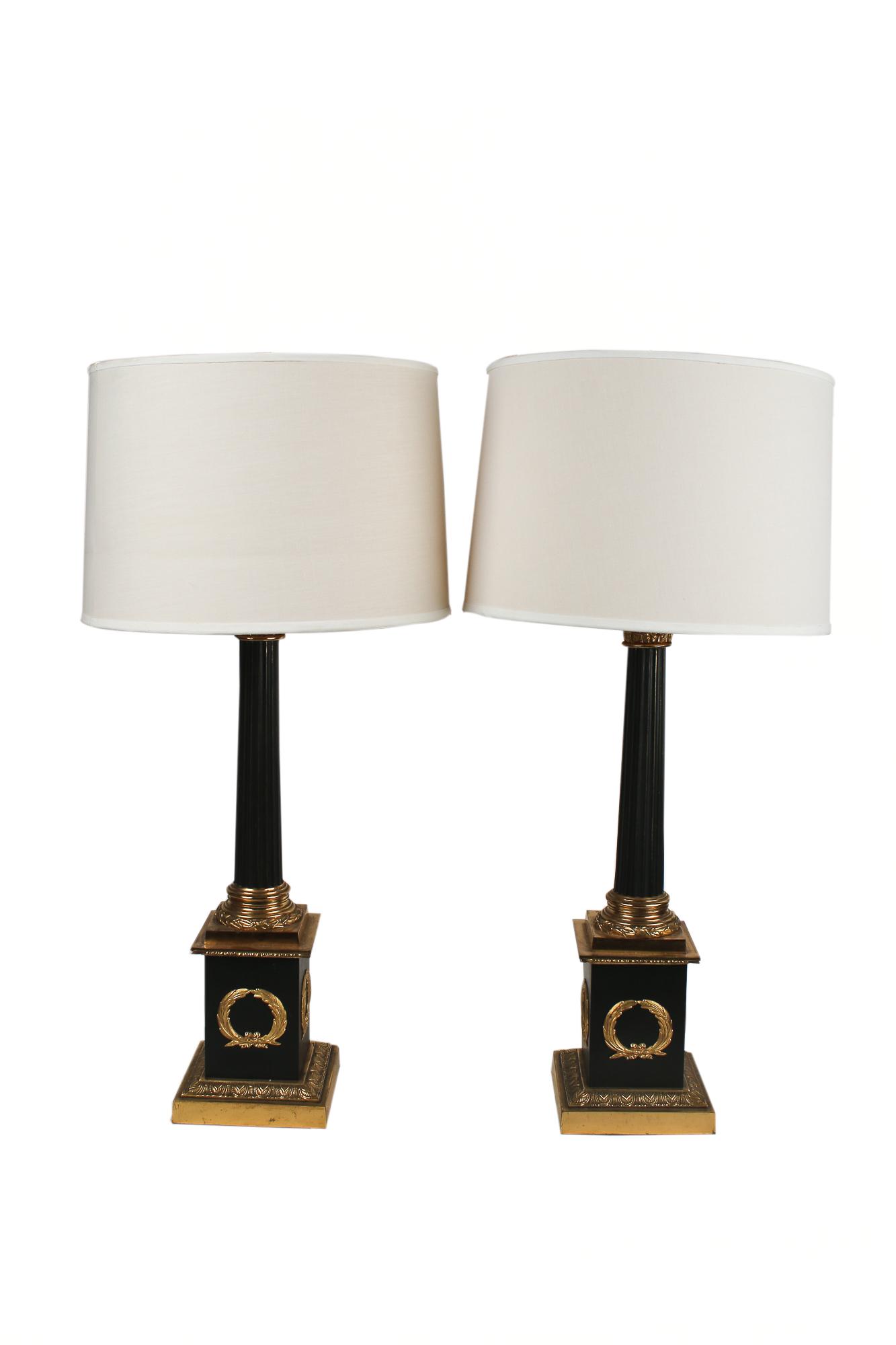 PAIR OF EMPIRE STYLE COLUMNAR TABLE LAMPS: patinated and gilt metal the columns with Corinthian capitals each with twin sockets Condition: good with minor wear to surfaces commensurate with age. each base 23 inches high; 33 1/2 total inches hi
