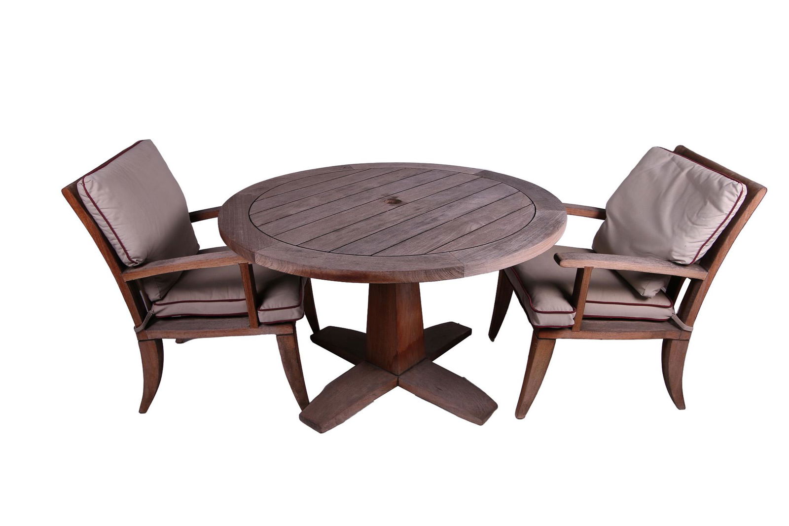 MICHAEL TAYLOR: TEAK PATIO SET: comprising a table and two armchairs Condition: with wear and exposure from elements the table: 48 inches diameter