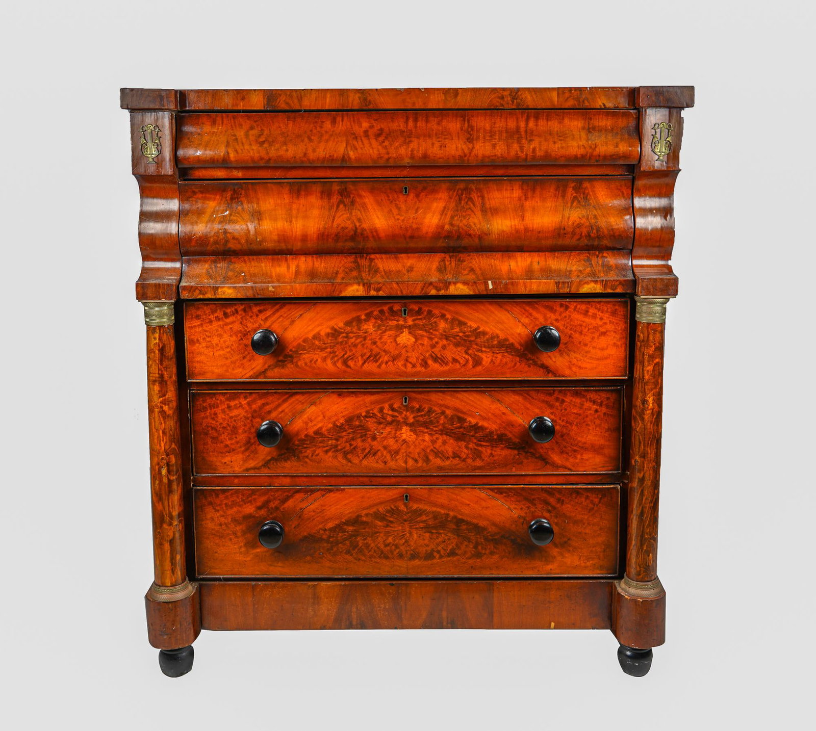 AMERICAN LATE CLASSICAL MAHOGANY VENEER CHEST OF: gilt metal mounted with oak secondary wood; with ebonized pulls Condition: with cracks to veneer, and split in wood across top 48 inches wide; 22 3/4 inches deep; 54 1/2 inches high