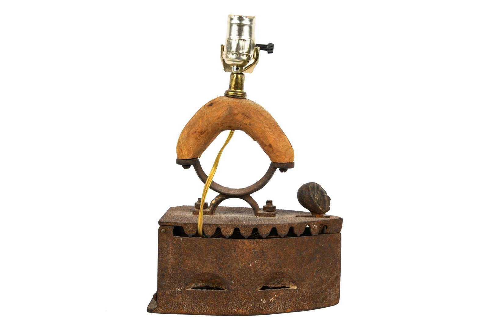 IRON TABLE LAMP: lamp constructed from antique iron with wood handle Condition: with loss to iron and rust consistent with age 4 inches wide; 9 inches deep; 13 inches high