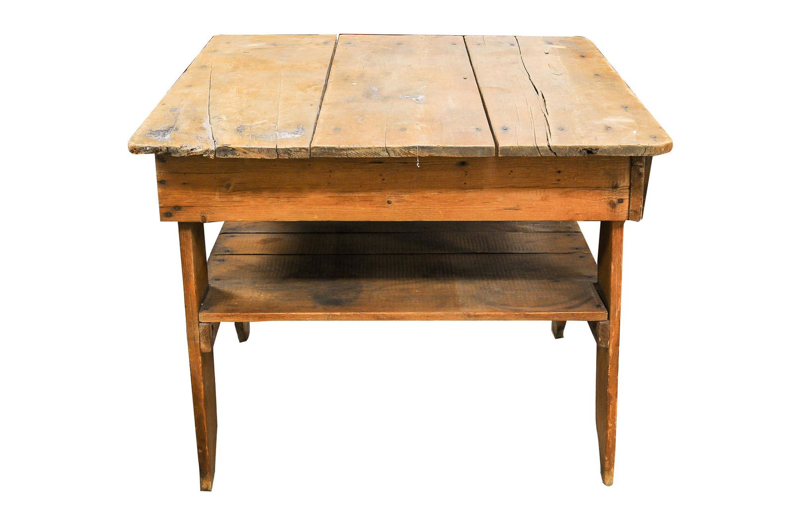 AMERICAN RUSTIC PINE WORK TABLE: 19th Century with a three-plank top on shaped panel supports joined by a planked shelf Condition: weathered and with separation cracks, marks, nicks and scuffs throughout 38 1/2 inches wide; 35 1/2 in