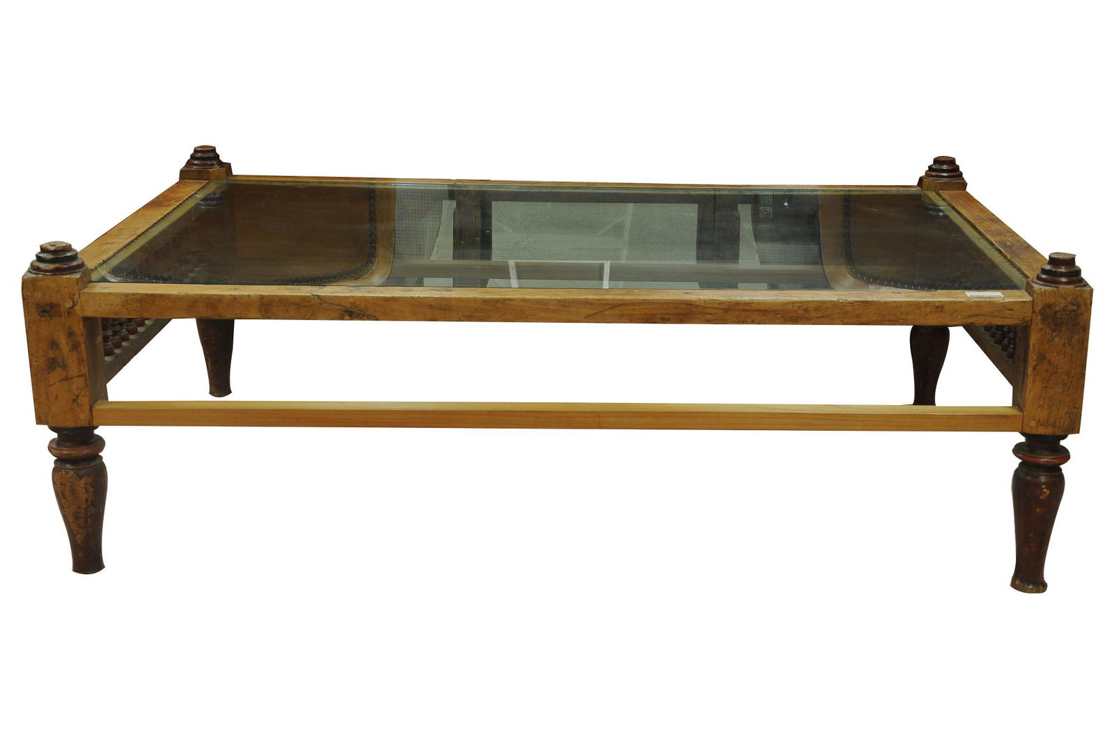 NATIVE AMERICAN BED COFFEE TABLE: Native American bed frame constructed into a glass inset coffee table with antique and later elements added 68 inches wide; 44 1/2 inches deep; 23 inches high