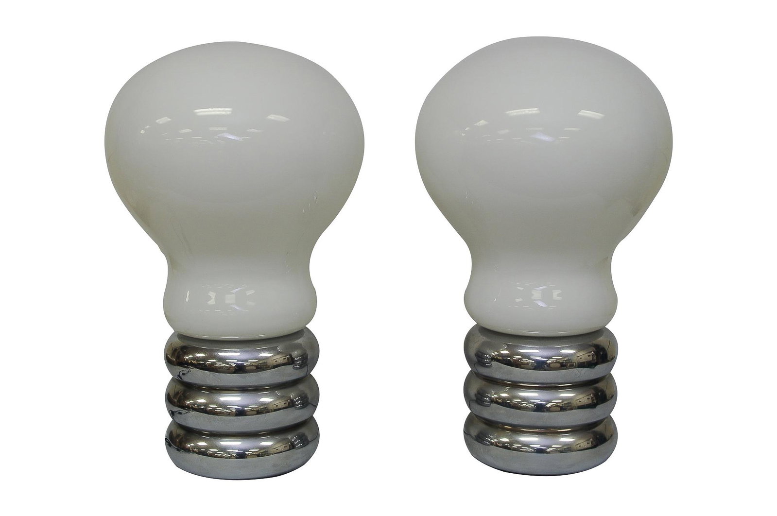 PAIR OF INGO MAURER BULB LAMPS: circa late 20th Century glass and chrome with label to base lower Condition: one in need of rewiring; with unseen chips to glass shades along lower edge where the shade meets the base 21 total inches 