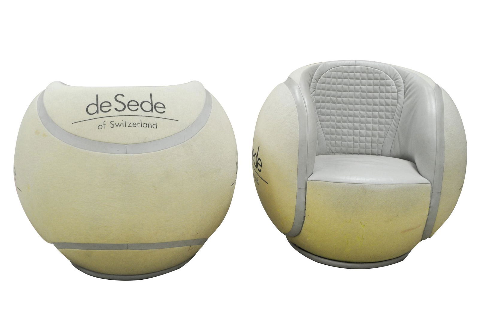 PAIR OF DE SEDE OF SWITZERLAND TENNIS BALL CHAIRS: circa 1980's Condition: faded; with loss to felt throughout and to leather lower 36 inches diameter; 32 inches high