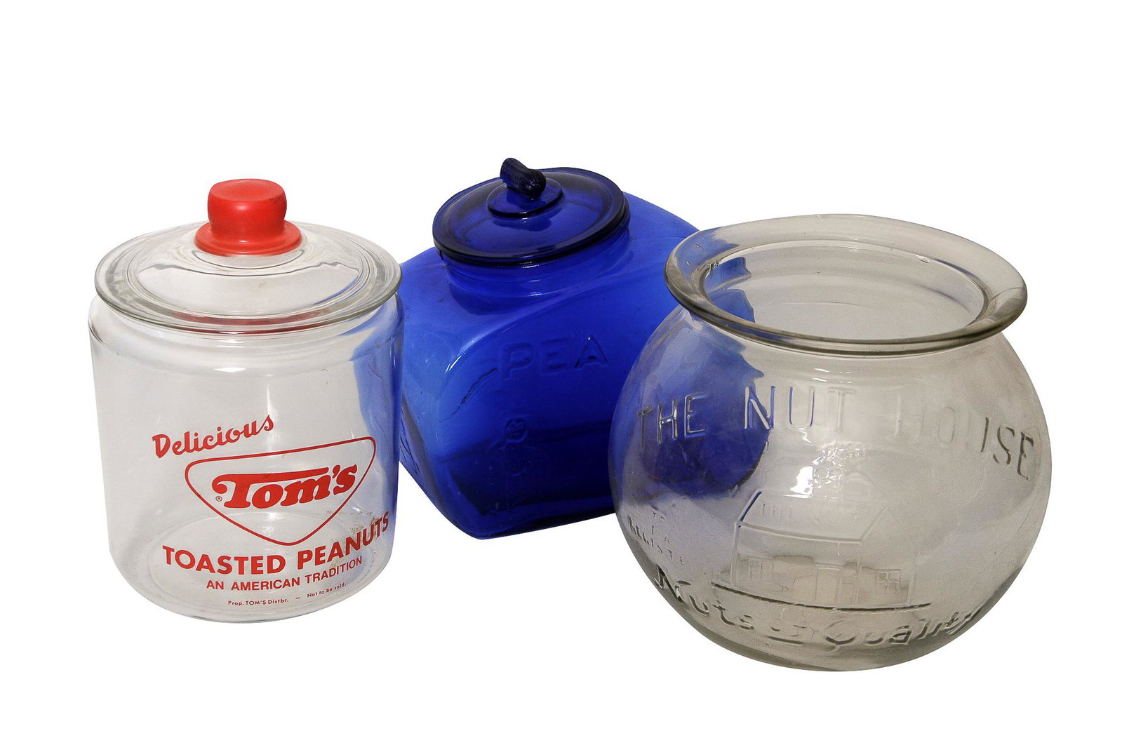 THREE GLASS PEANUT JARS: circa 20th Century glass and colored glass including Mr. Peanut, The Nut House and Tom's Condition: Tom's jar with damage along inner rim ranging from 9 to 10 inches high