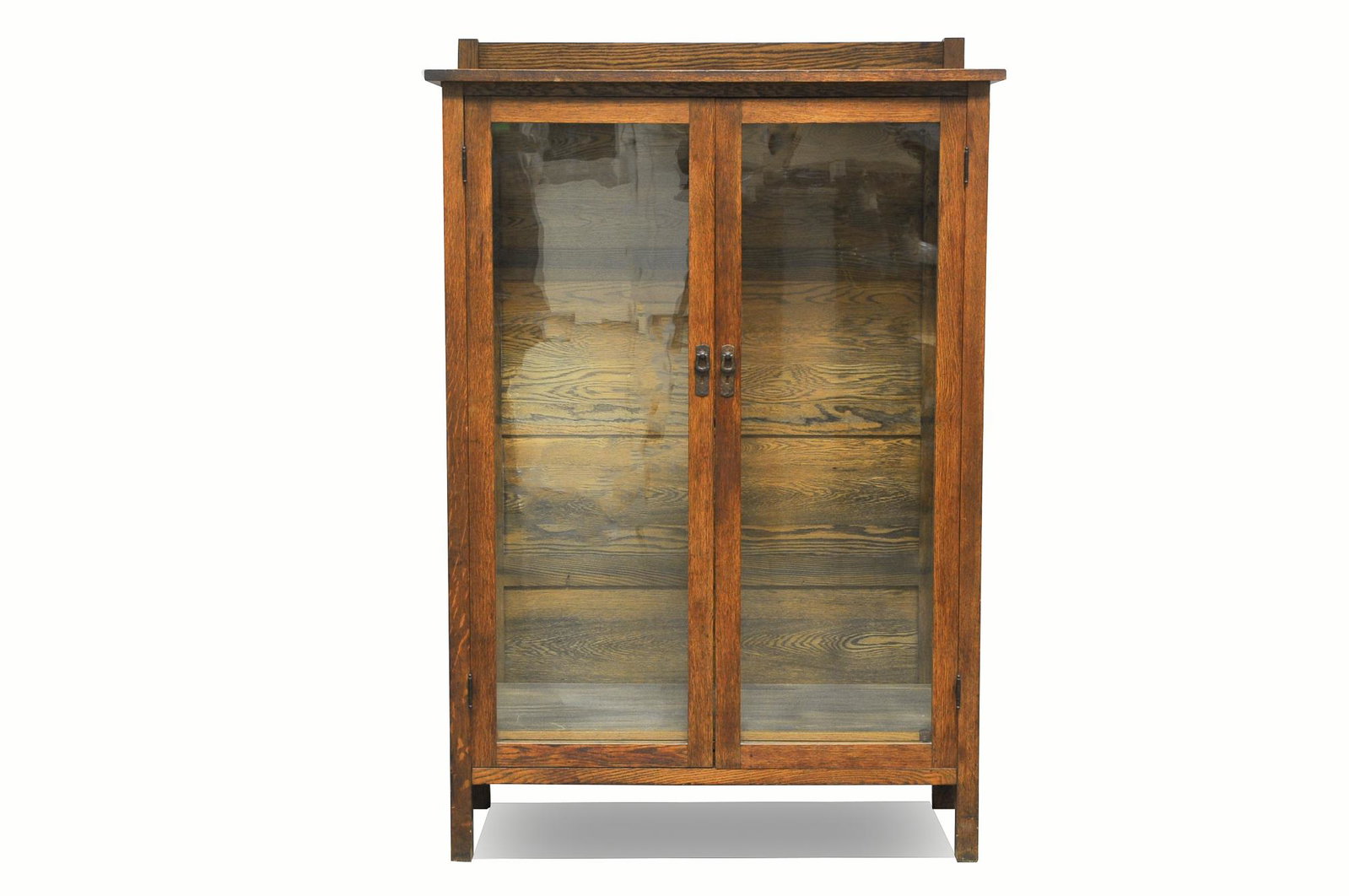 STICKLEY BROTHERS ARTS & CRAFTS CHINA CABINET: oak with four shelves Provenance: Craftsman Arts & Crafts Auction, March 10, 2001, Pittsfield, MA [Lot 454] Condition: no key 42 inches wide; 17 1/4 inches deep; 62 1/2 inches high