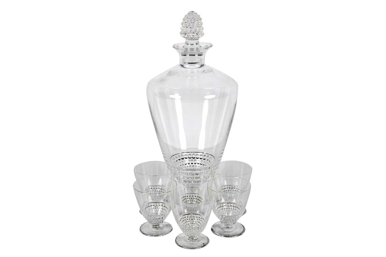 RENE LALIQUE GLASS DECANTER SET: Nippon pattern circa 1935 each piece marked R. Lalique France to underside comprising: a decanter and six cordials Condition: no apparent damages the decanter: 10 inches high; the cordials: 2 1/4 inch