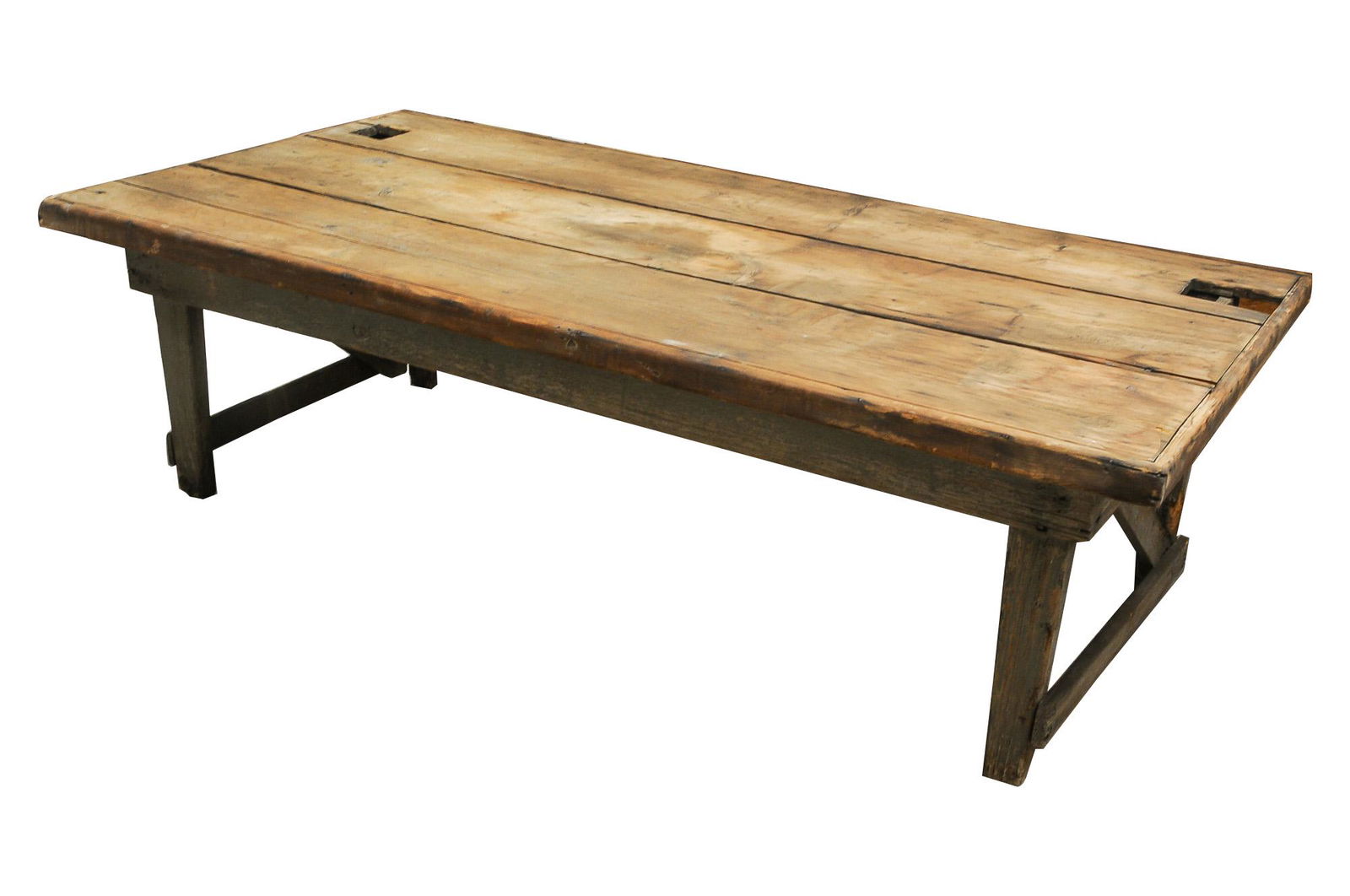 PRIMITIVE PINE LOW WORK TABLE: with a painted base Condition: weathered with extensive wear, water stains and losses; the top with two large rectangular cut-outs. 72 inches wide; 37 inches deep; 22 inches high