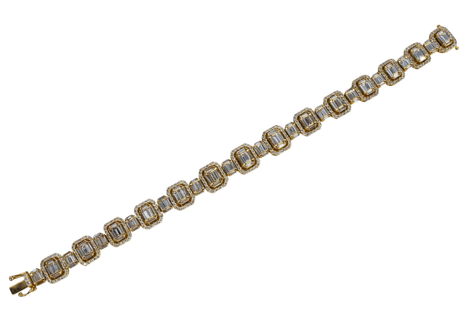 18 KARAT YELLOW GOLD & DIAMOND BRACELET: containing straight and tapered baguette cut diamond links with a halo of full cut diamonds [H-I/VS2-SI2] weighing approximately 7.00 carats total 20.7 grams 7 inches long