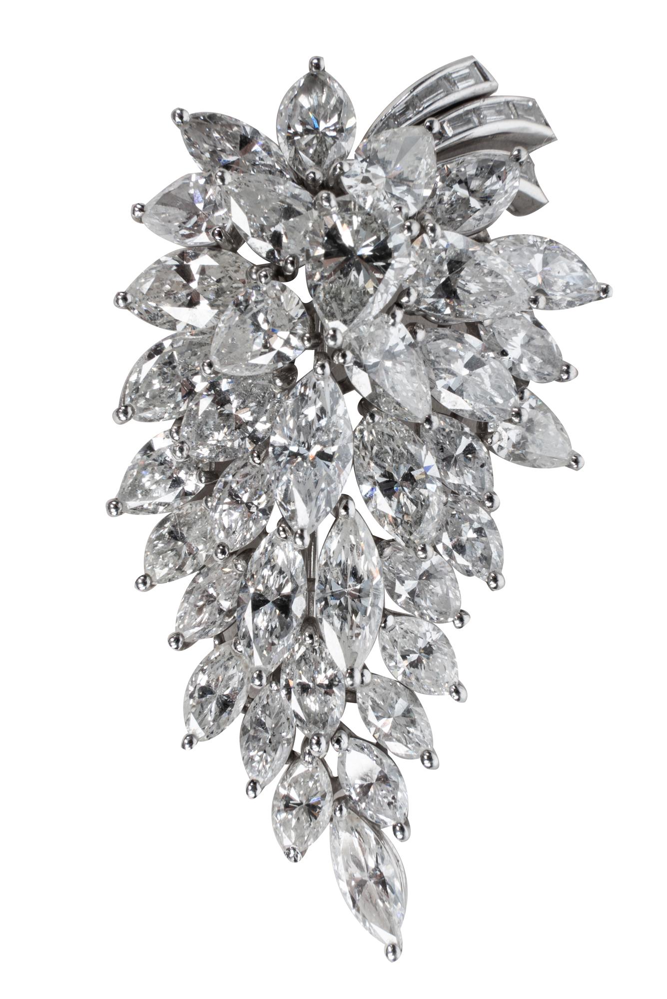 PLATINUM & DIAMOND CLUSTER BROOCH: containing marquise, pear, and baguette cut diamonds [G-I/SI2/I1] weighing approximately 12.00 carats total 18.4 grams 2 inches long