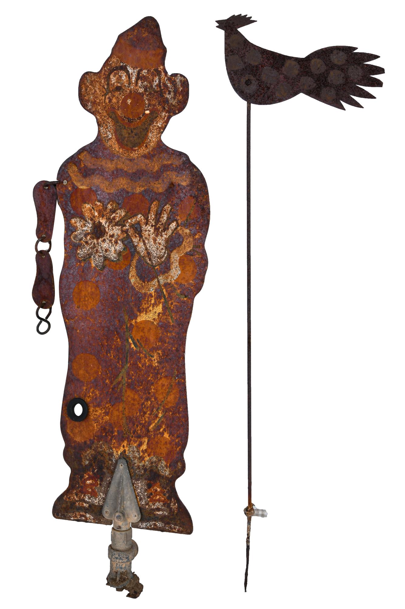 TWO ASSORTED METAL GARDEN DECORATIONS: including: a painted iron clown form sprinkle/hose attachment and a free standing tole rooster Condition: each heavily weathered; rooster bent lower the clown: 26 inches high; the rooster: 9 1/2 inche
