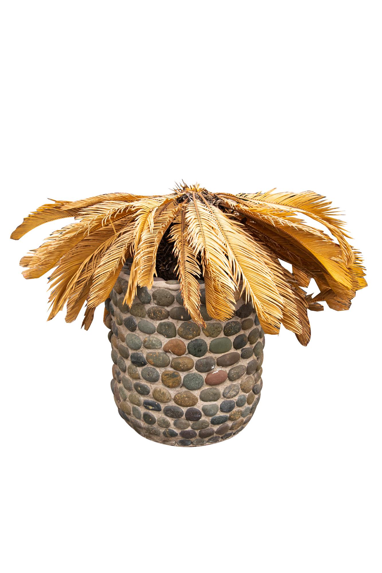 RIVER ROCK CYLINDRICAL PLANTER: earthenware coated in cement and river rocks Condition: weathered; with cracking and missing rocks 18 inches diameter; 20 inches high