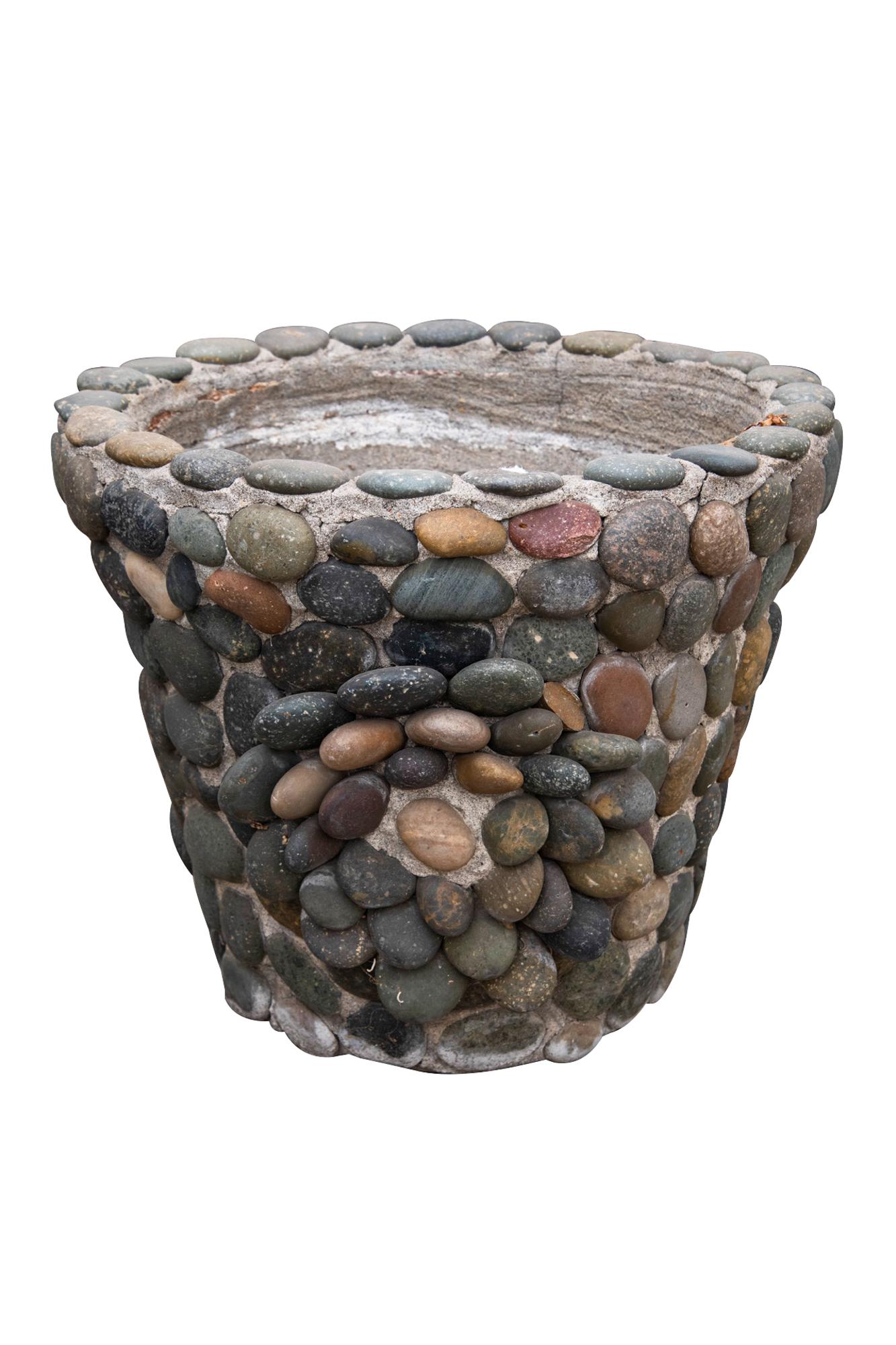 RIVER ROCK PLANTER: earthenware coated in cement and river rocks Condition: weathered: with some cracking and missing rocks 20 inches diameter; 17 inches high