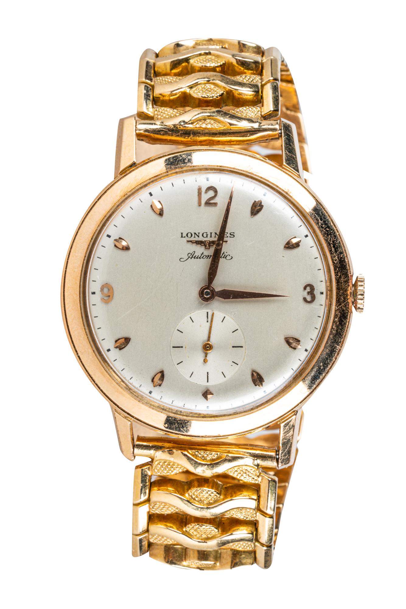 LONGINES 18 KARAT YELLOW GOLD WRIST WATCH: the 30.00 mm round off-white dial signed 'Longines Automatic' under 12:00 position; the sunken seconds dial above 6:00 position 56.5 grams total the bracelet: 7 inches long x 18.00 mm wide