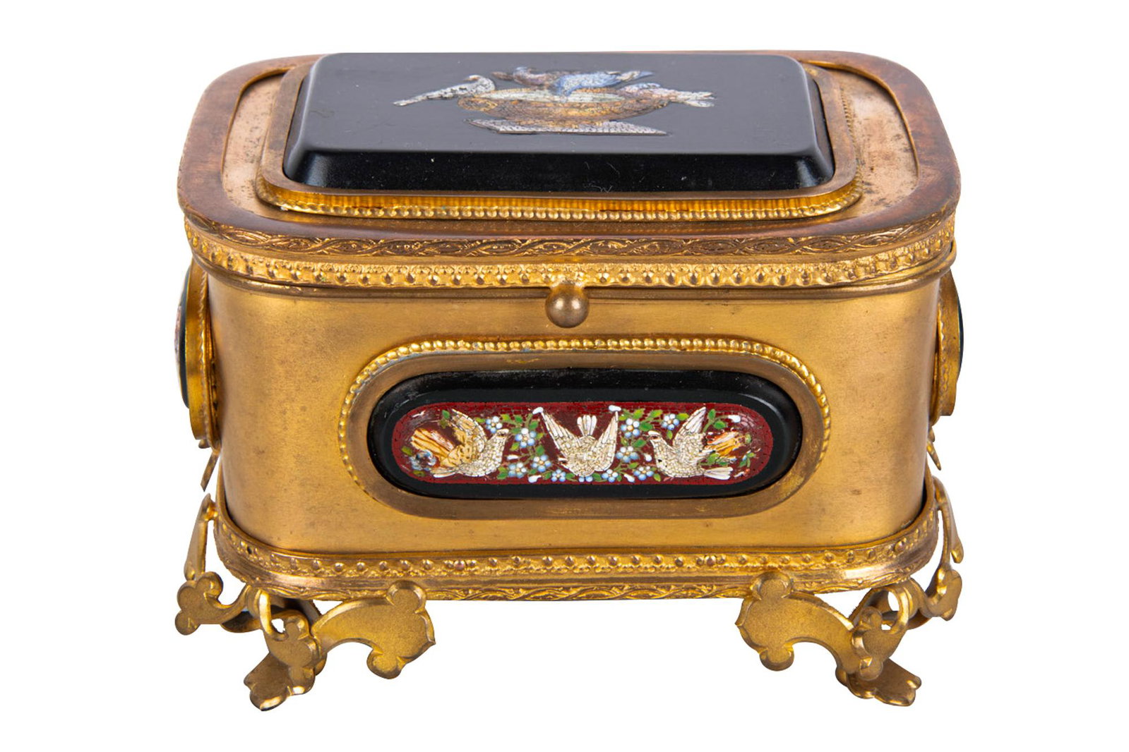 STONE-INSET GILT METAL BOX: impressed mark "Guttin", with enameled decoration to panels on four sides, velvet-lined cover and base, and silk cushion 5 inches wide; 3 1/4 inches deep; 3 1/2 inches high