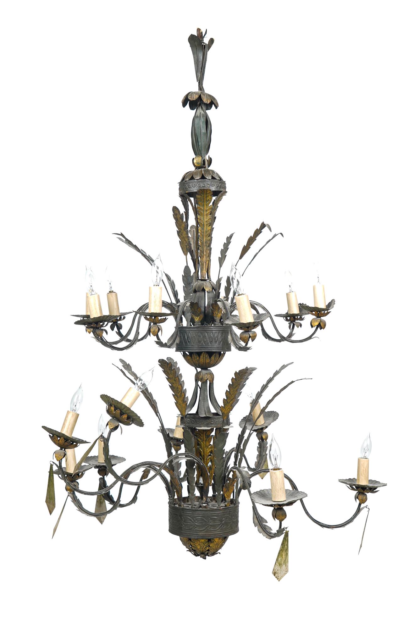 TOLE FIFTEEEN-LIGHT CHANDELIER: Provenance: A Michael Smith installation Condition: bending to some pieces. Oxidation throughout. 33 inches diameter; 48 inches high