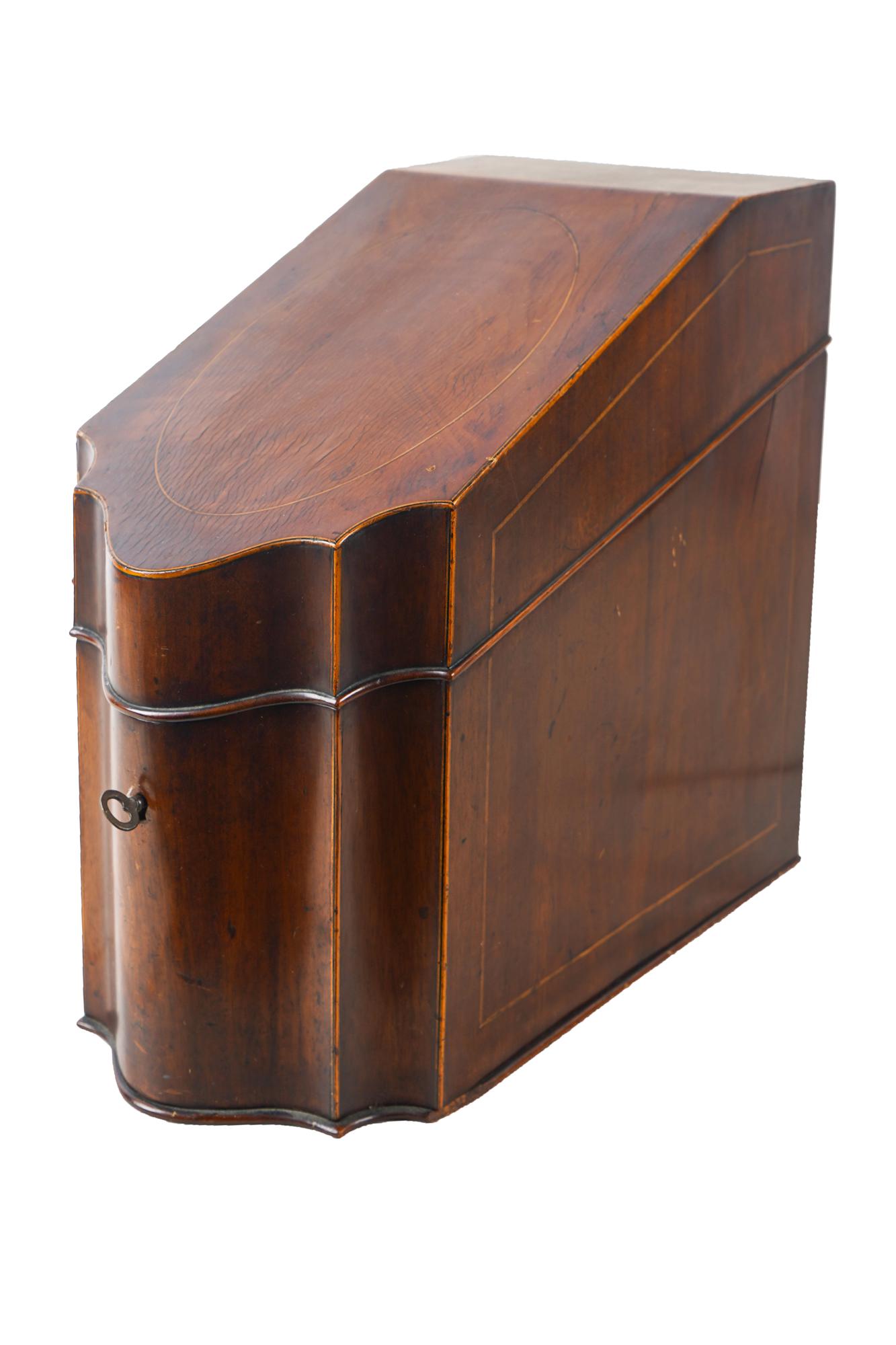 ENGLISH MAHOGANY KNIFE BOX: with line inlay Condition: with scratches, nicks and wear. The interior fittings missing. With key. 8 1/4 inches wide; 15 inches deep; 14 1/2 inches high