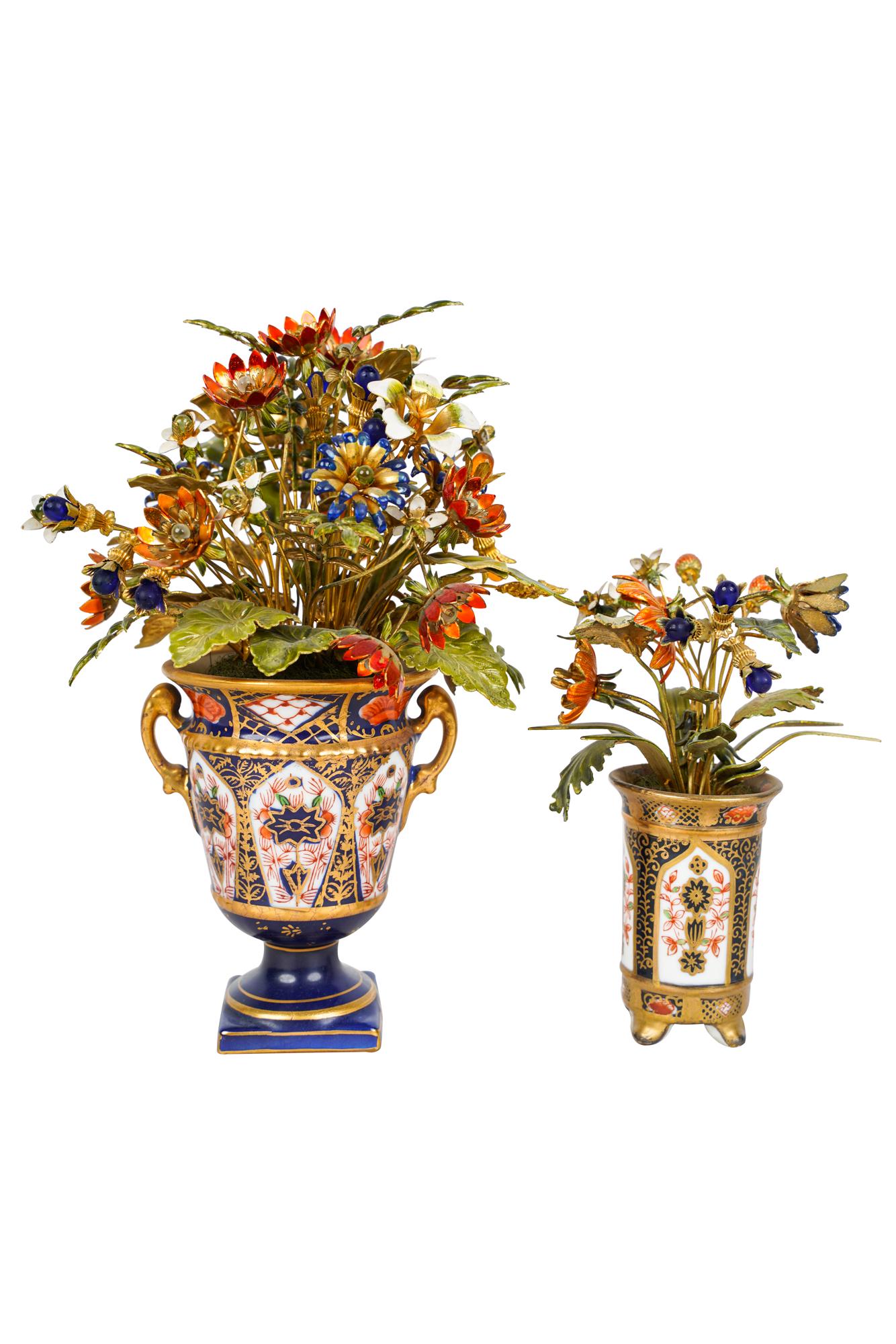 TWO IMARI PORCELAIN & ENAMEL FLOWER GROUPS: Condition: with some rubbed wear to gilding the tallest: 7 1/2 inches high