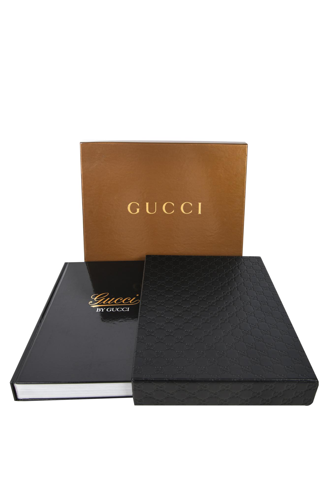 GUCCI BY GUCCI COFFEE TABLE BOOK: with fitted box and fitted cover 14 1/2 inches long; box measuring: 15 1/4 x 11 3/4 x 3 inches