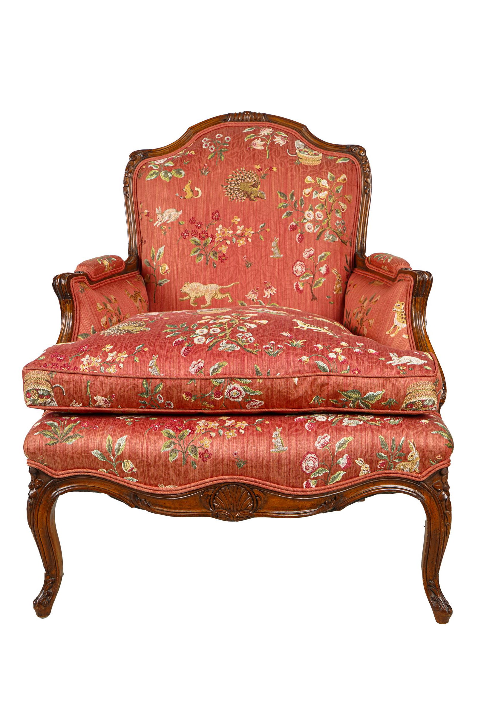 LOUIS XV STYLE BERGERE: fist hald 20th century with red floral and animal print upholstery and down-filled seat cushion 29 1/2 inches wide; 25 inches deep; 37 inches high; seat height: 18 inches