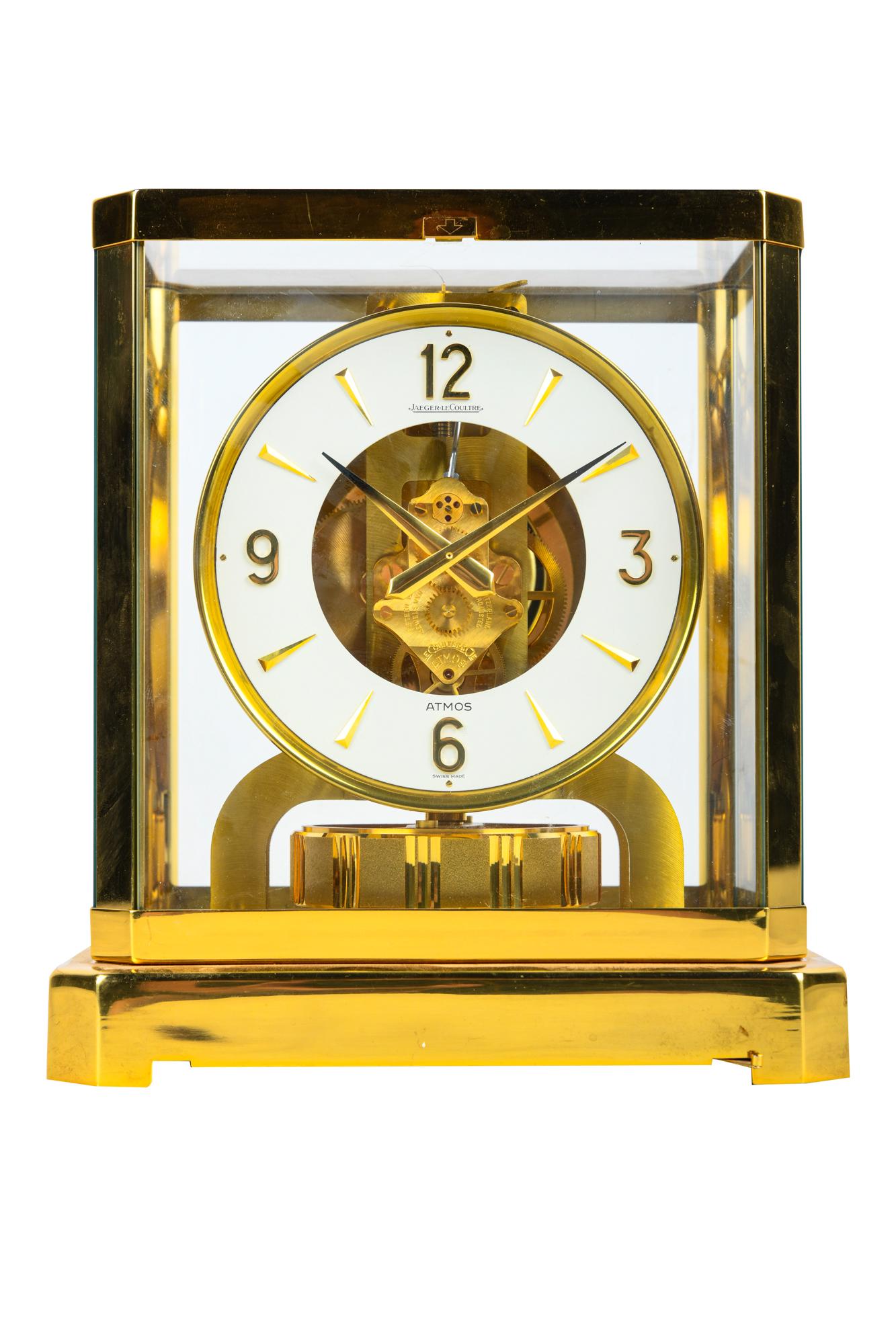 JAEGER LECOULTRE ATMOS CLOCK: signed to dial "Atmos / Swiss Made" signed to movement "Le Coultre Atmos" serial number 379077 within a brass and glass case 8 1/2 inches wide; 6 1/4 inches deep; 9 1/4 inches high