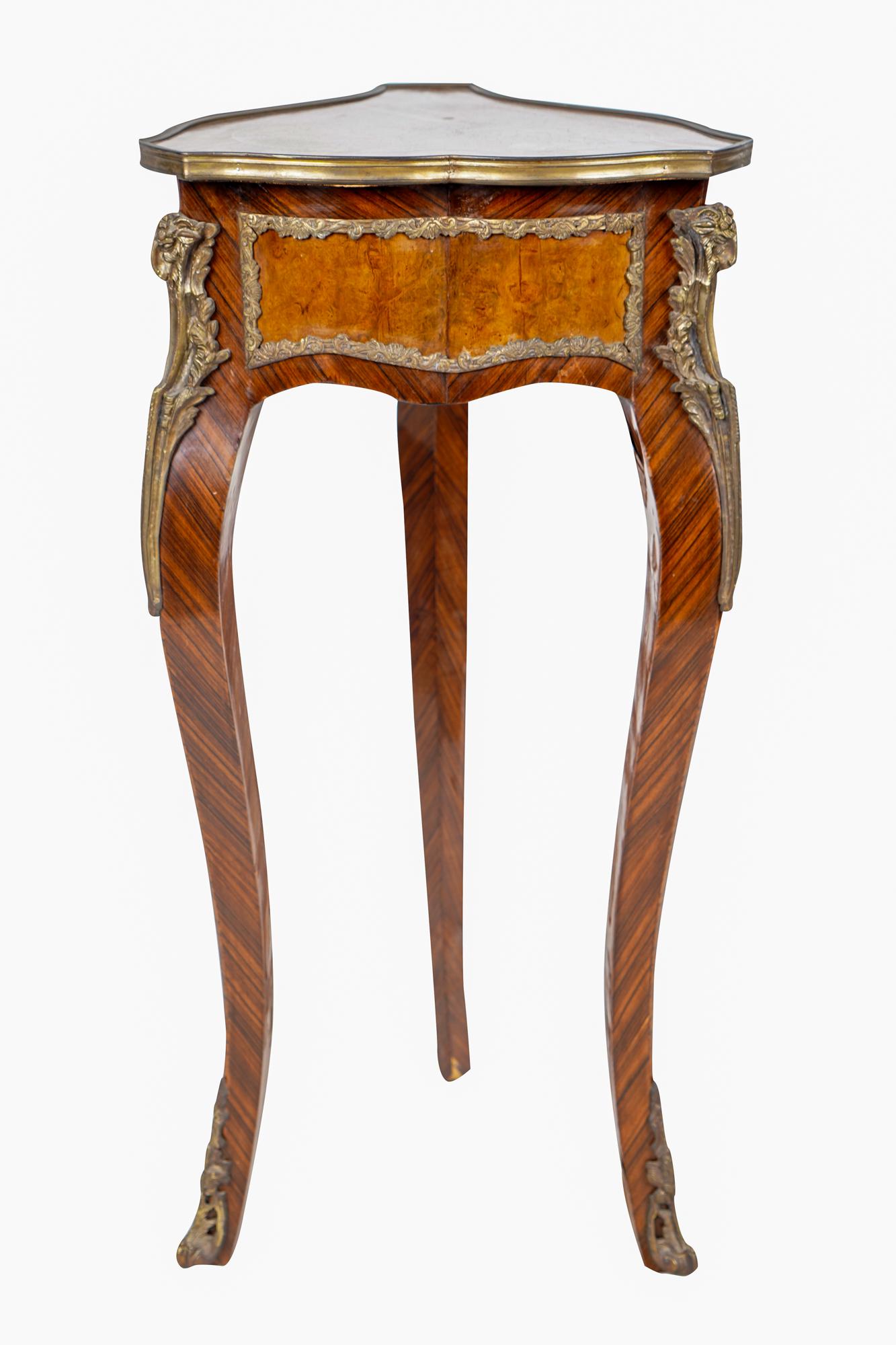 LOUIS XV- STYLE GILT-BRONZE-MOUNTED GUERIDON: with inlaid triangular top over 16 inches wide; 14 1/2 inches deep; 33 1/4 inches high