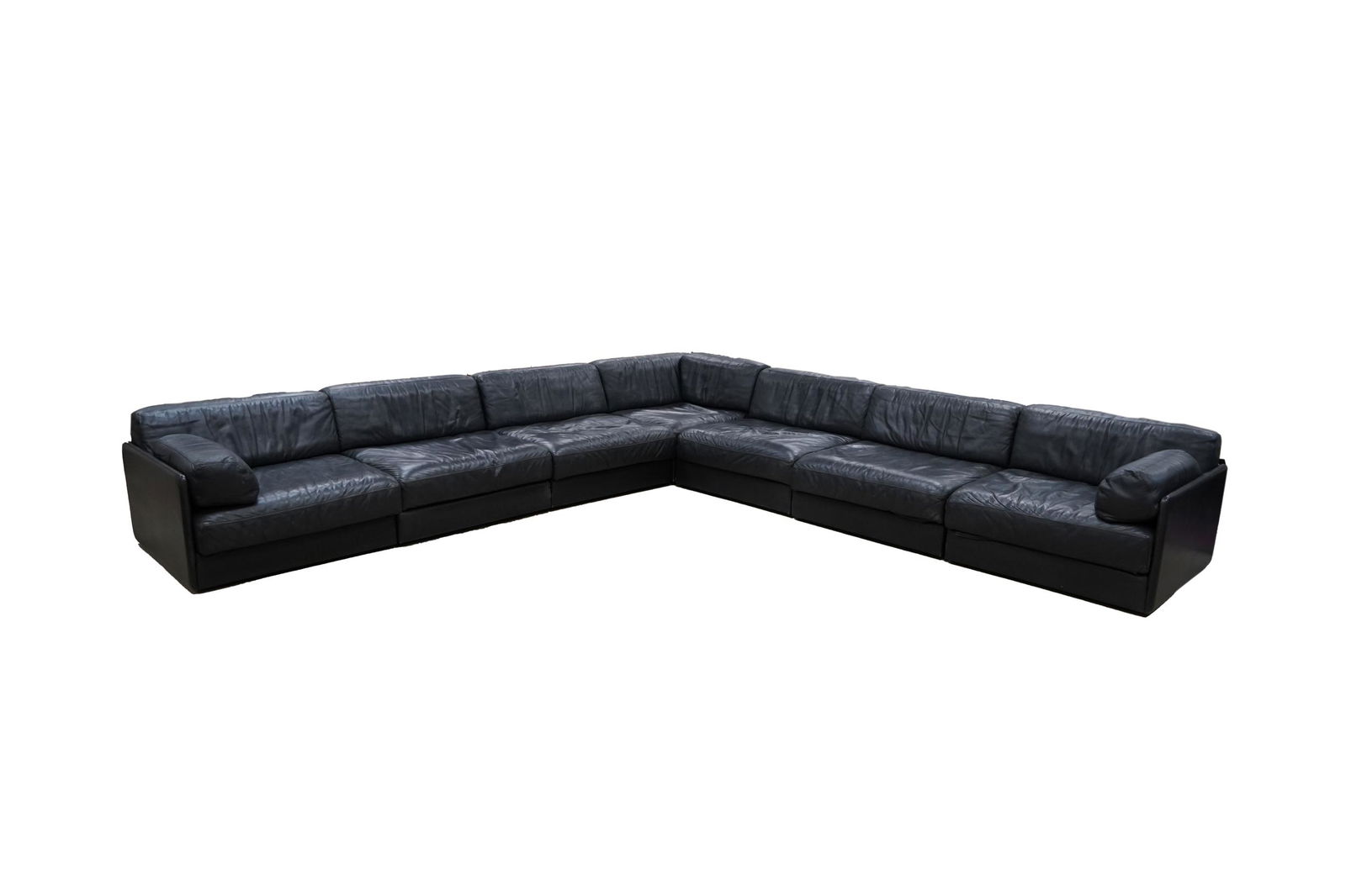 SIX-SECTION DE SEDE SOFA: black leather corner piece: 37 inches square; 21 inches high; each section: 36 inches wide; 37 inches deep