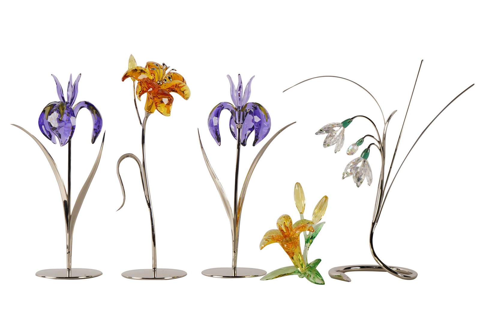 FIVE ASSORTED SWAROVSKI FLOWER GROUPS: Condition: with boxes; creases and wear to boxes the blue flowers: 8 inches high