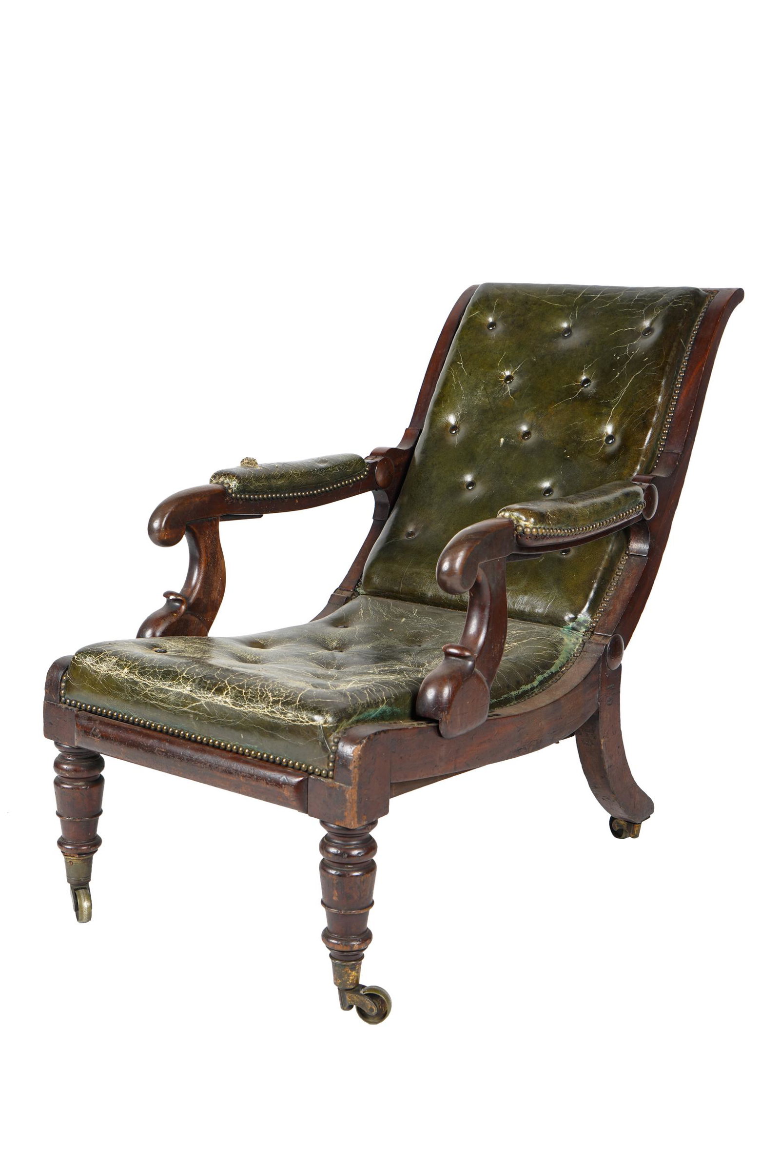 REGENCY MAHOGANY RATCHET ARMCHAIR: with period green leather upholstery, on metal casters 22 inches wide; 32 inches deep; 36 1/2 inches high