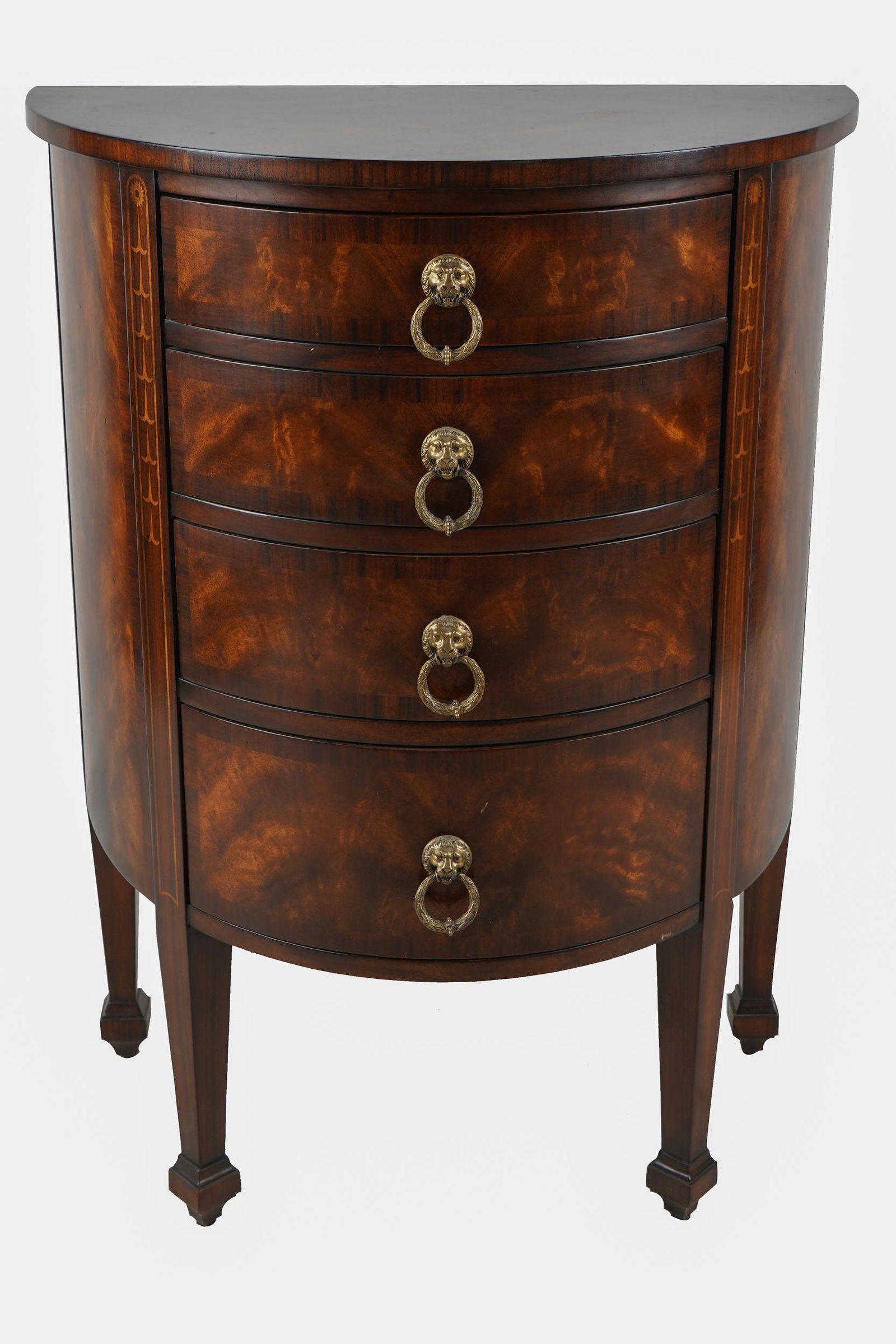 REGENCY STYLE INLAID MAHOGANY DEMILUNE CHEST: late 20th century, with four drawers, each with lion's head ring pull 27 inches wide; 17 inches deep; 36 inches high