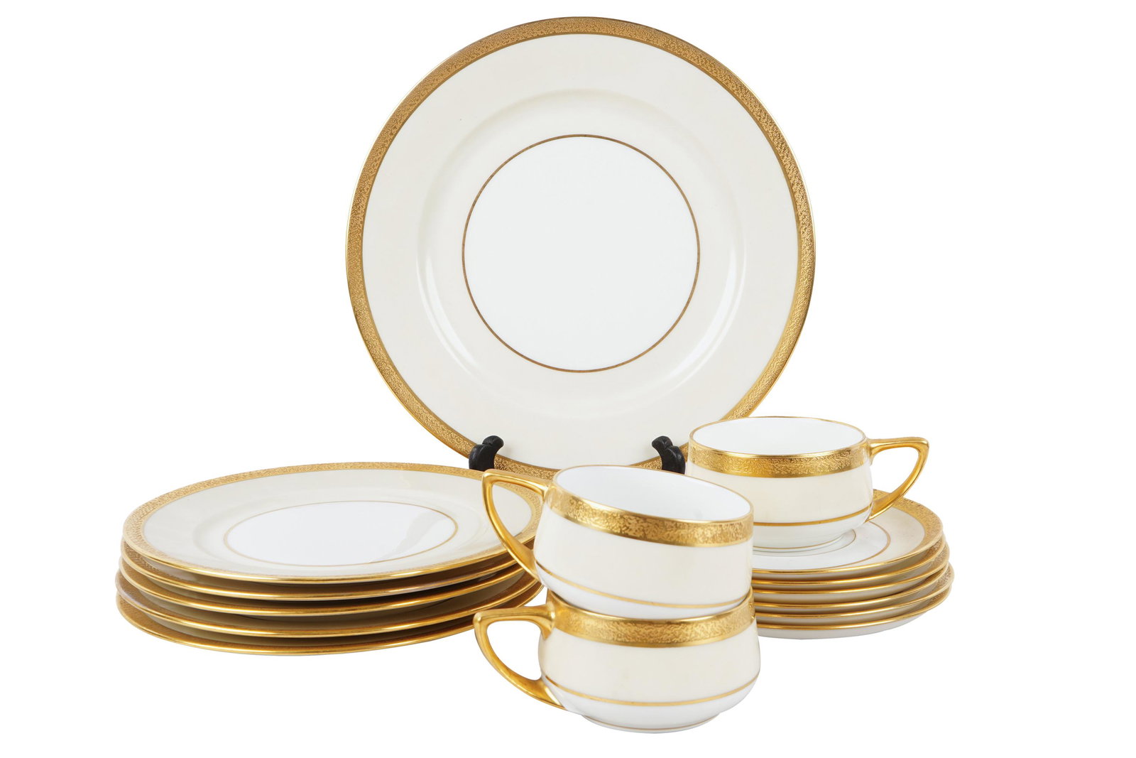 ROSENTHAL GILT RIM PORCELAIN SERVICE: comprising: 12 dinner plates (10 inches diameter), 12 salad plates (7 3/4 inches diameter), 12 bread plates (6 inches diameter), 12 underplates and 12 teacups [60 total pieces]