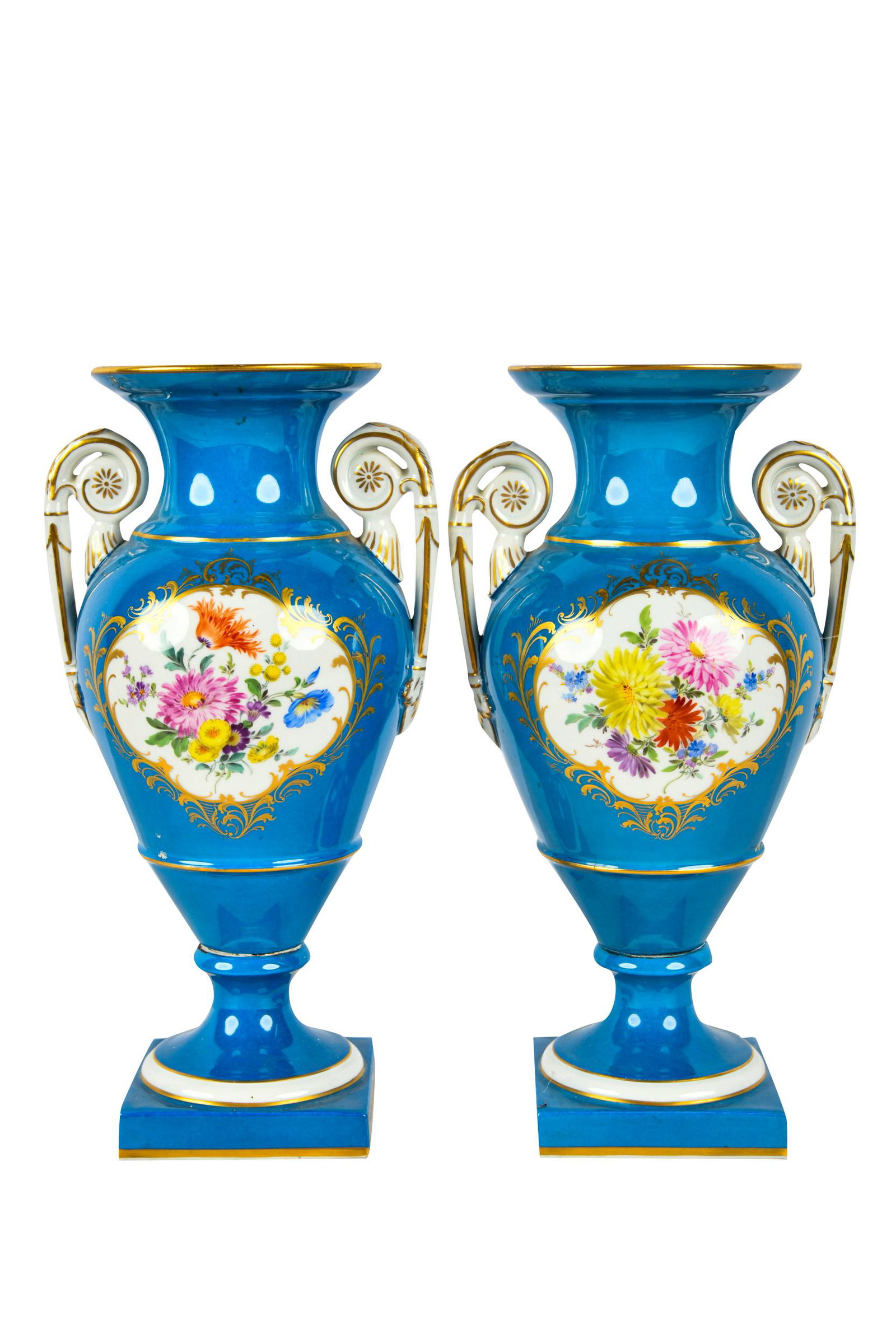 PAIR OF MEISSEN PORCELAIN URNS: underglaze blue crossed swords mark to undersides Condition: one with damage and visible repair to upper rim. each: 12 inches high