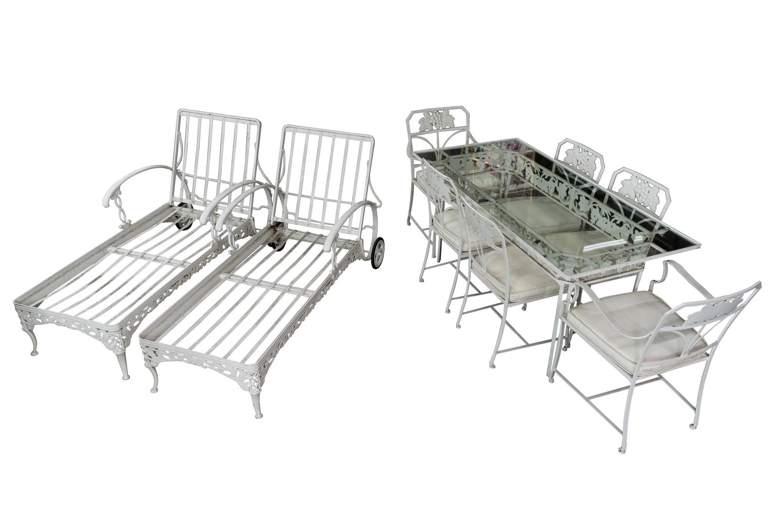 WHITE PAINTED PATIO TABLE, SIX CHAIRS & TWO CHAISES: with a grape vine motif table base: 60 inches wide; 30 inches deep