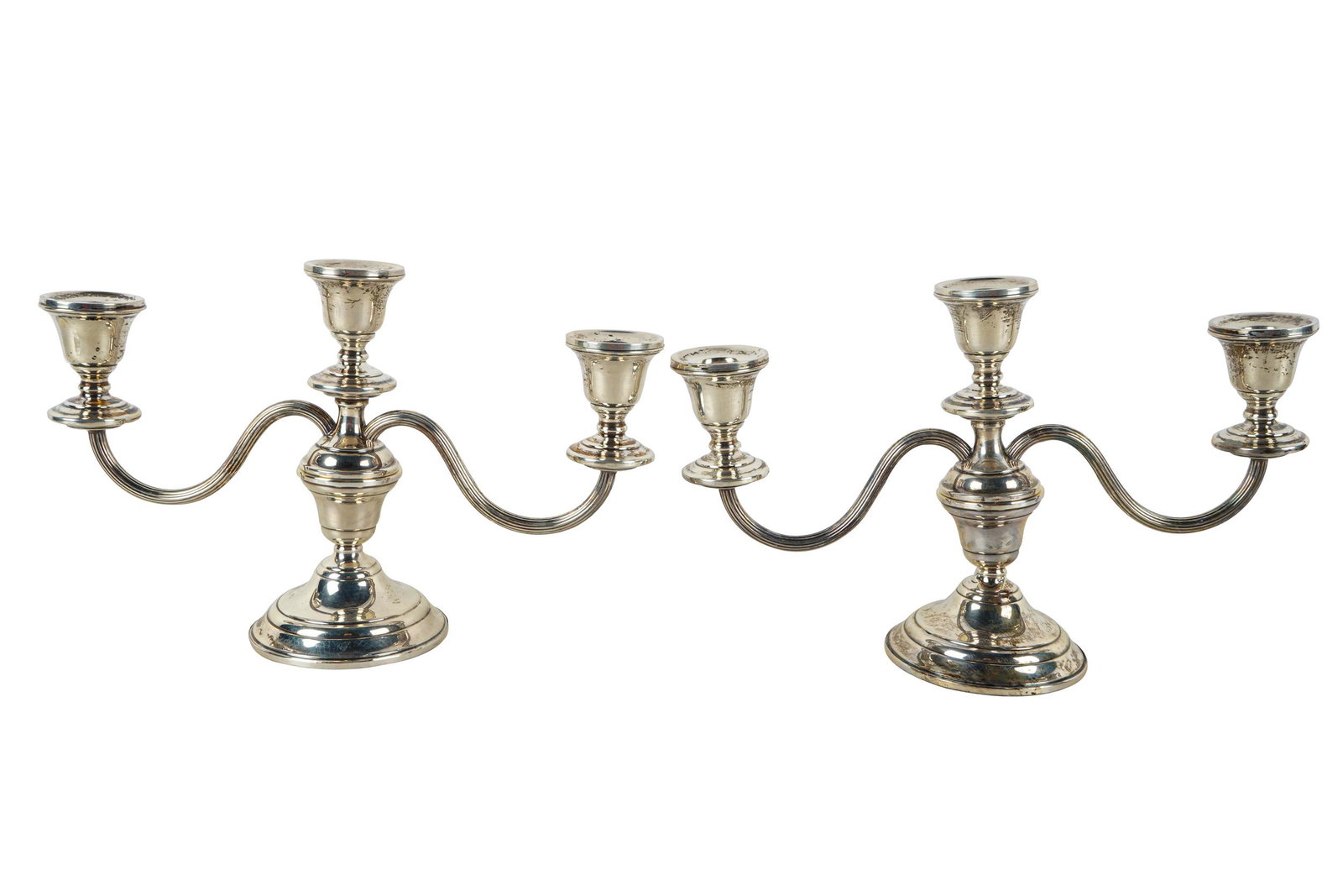 PAIR OF WEIGHTED STERLING CANDELABRA: Provenance: The Estate of Valerie Franklin 11 inches wide; 7 1/4 inches high