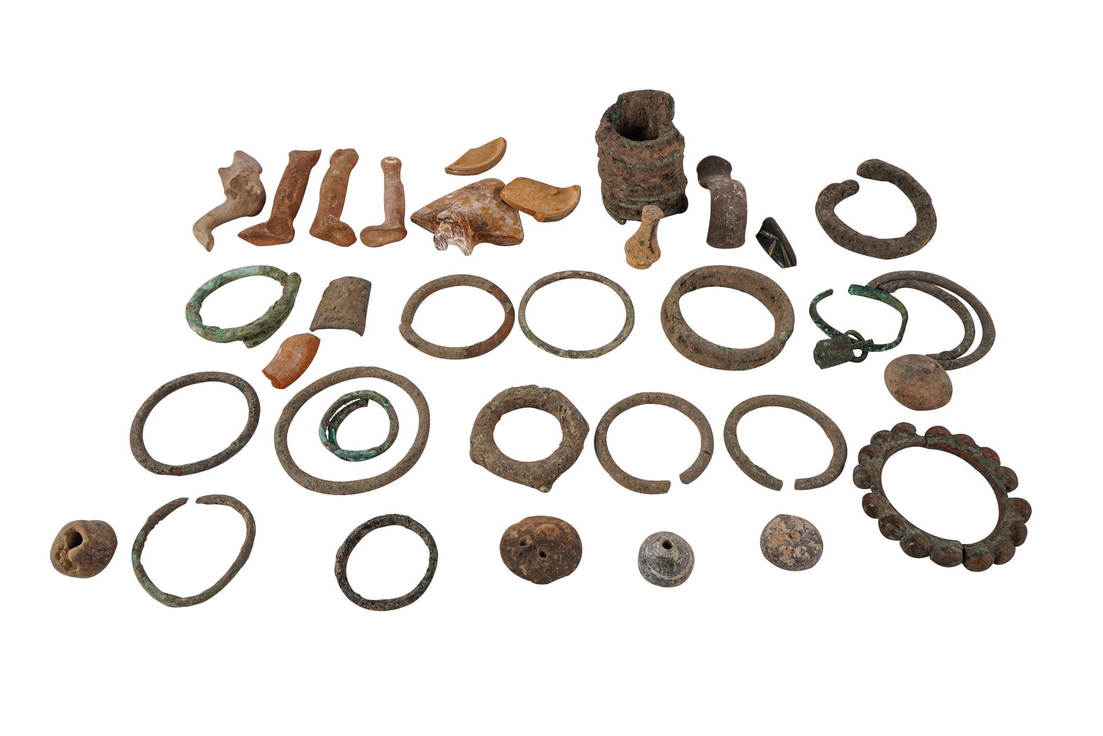 SMALL COLLECTION OF ANTIQUITY FRAGMENTS: fragmentary pieces of earthenware and ceramics Provenance: The Estate of Valerie Franklin arrow shaped fragment: 3 1/4 inches wide; 3 1/4 inches deep
