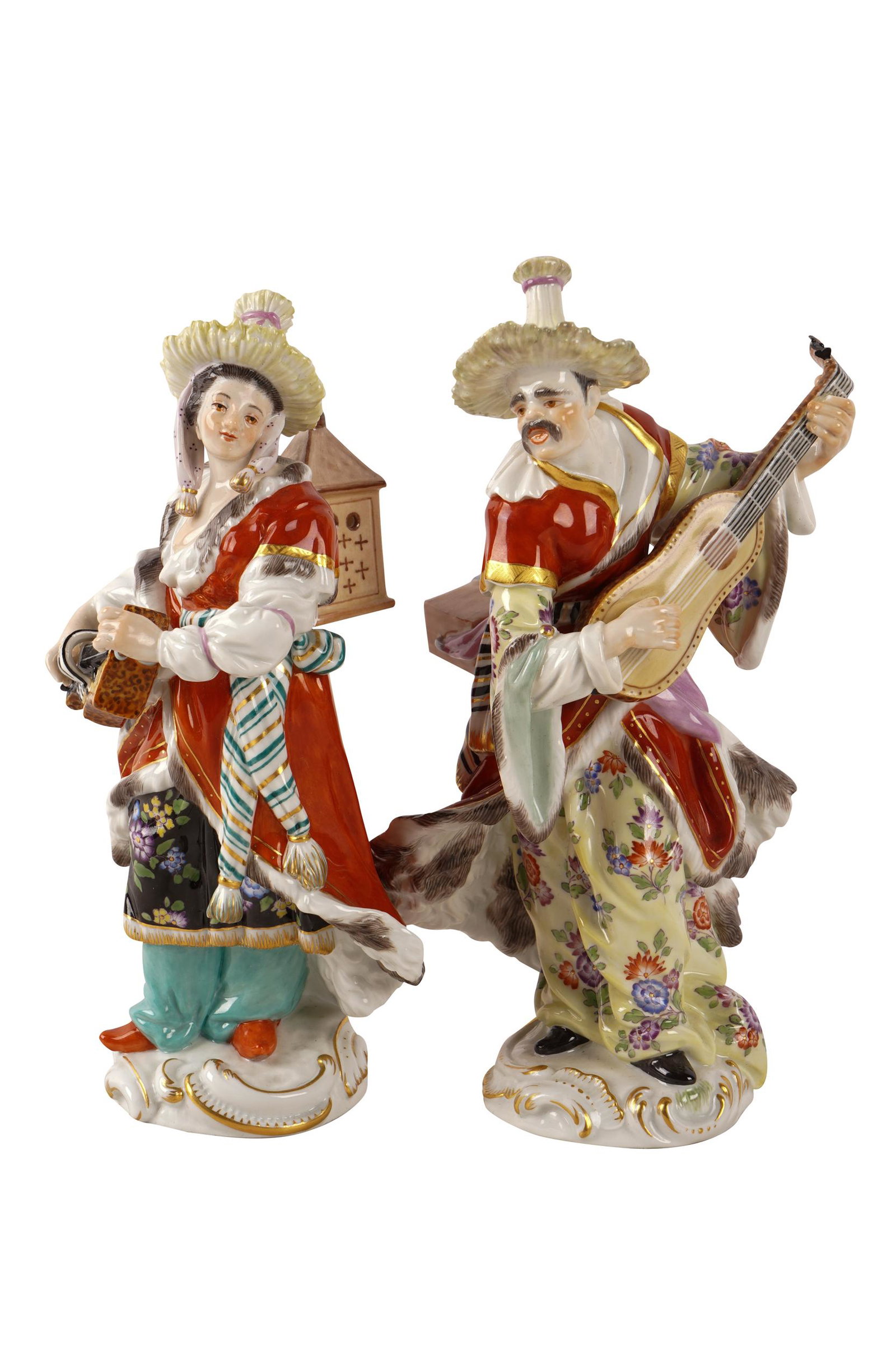 PAIR OF MEISSEN PORCELAIN FIGURES: each marked underside Condition: with breaks to upper part of guitar on one figure and on leaves on the other figure each: 7 inches high