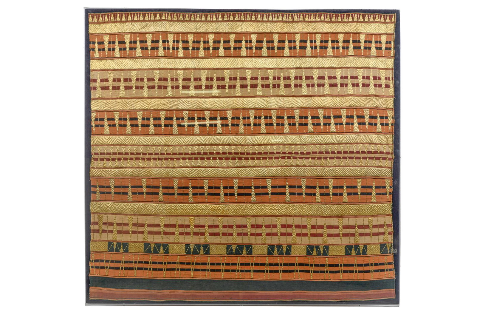 BALINESE CEREMONIAL PRADA CLOTH: with gold embroidery; in an acrylic frame the cloth 45 x 47 inches